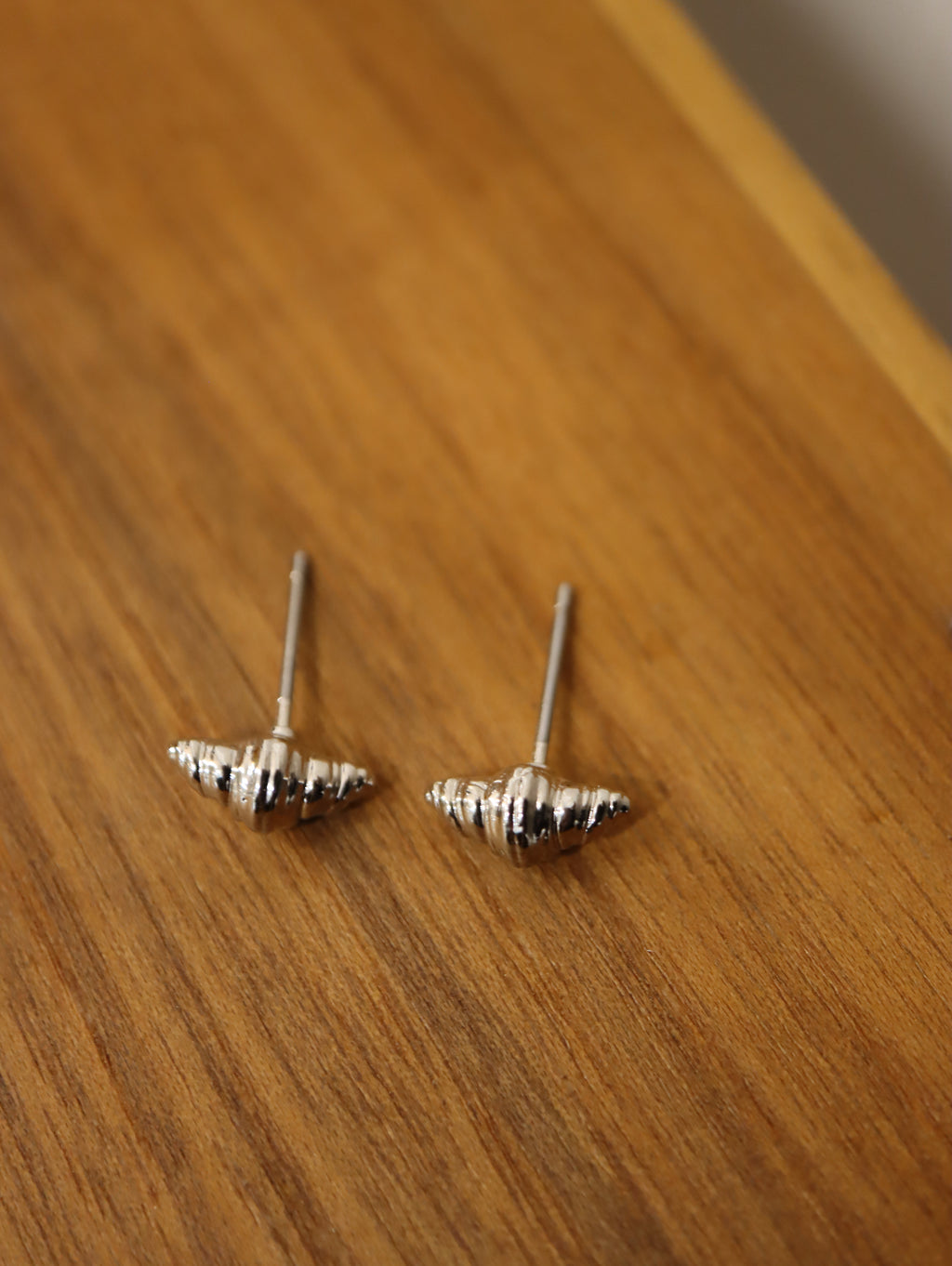 Mini croissant brass earrings