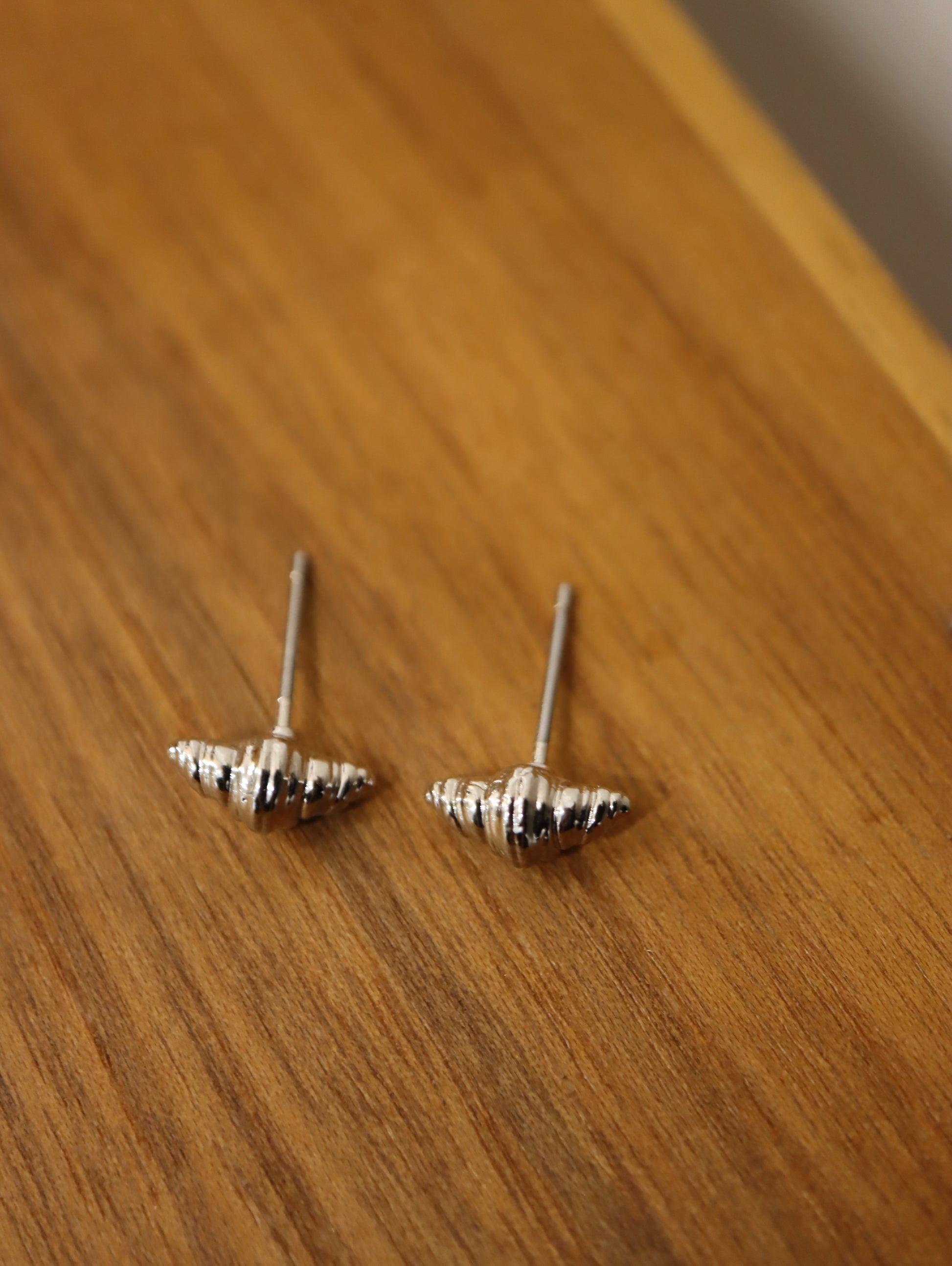 Mini croissant brass earrings