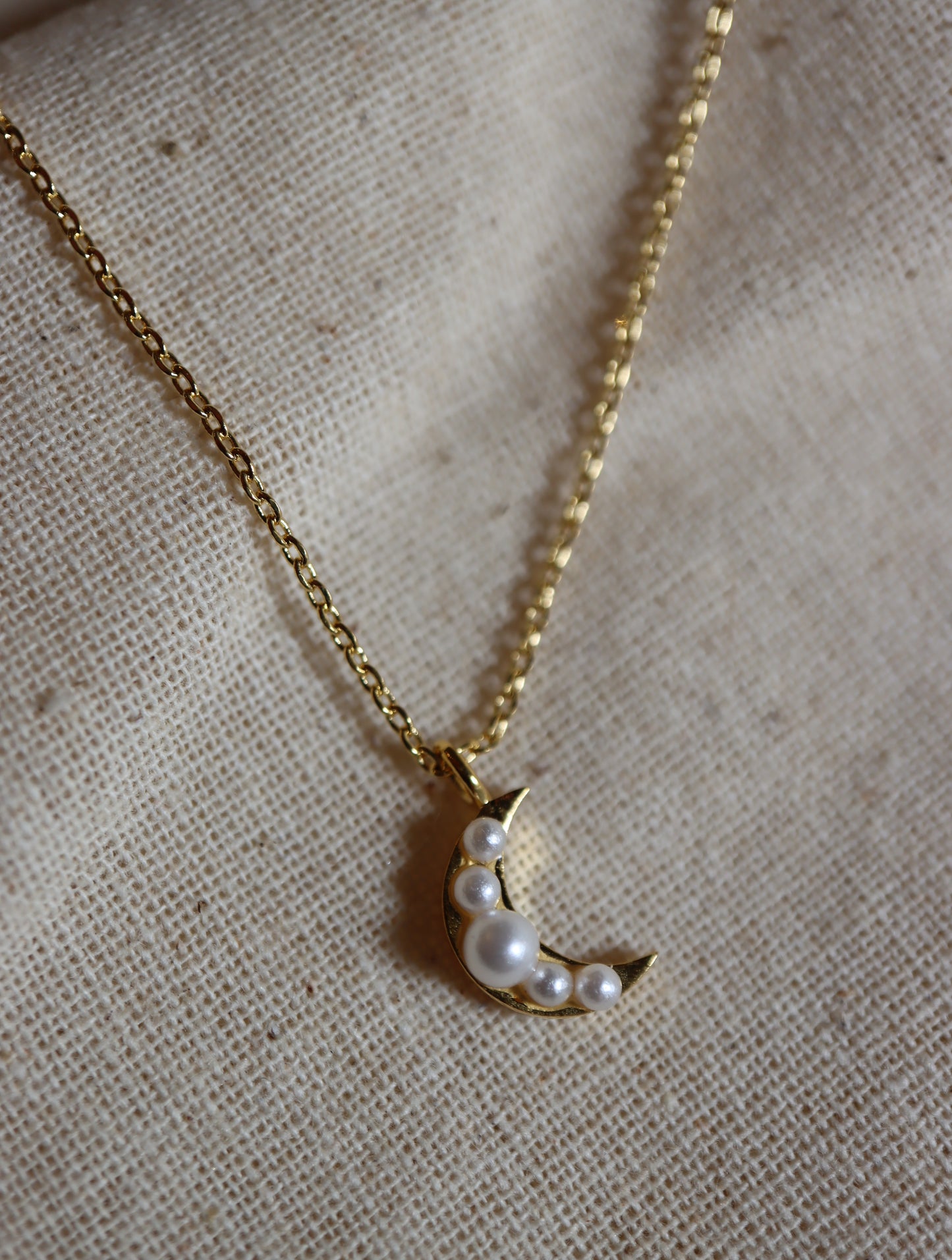 Pearls studded crescent necklace