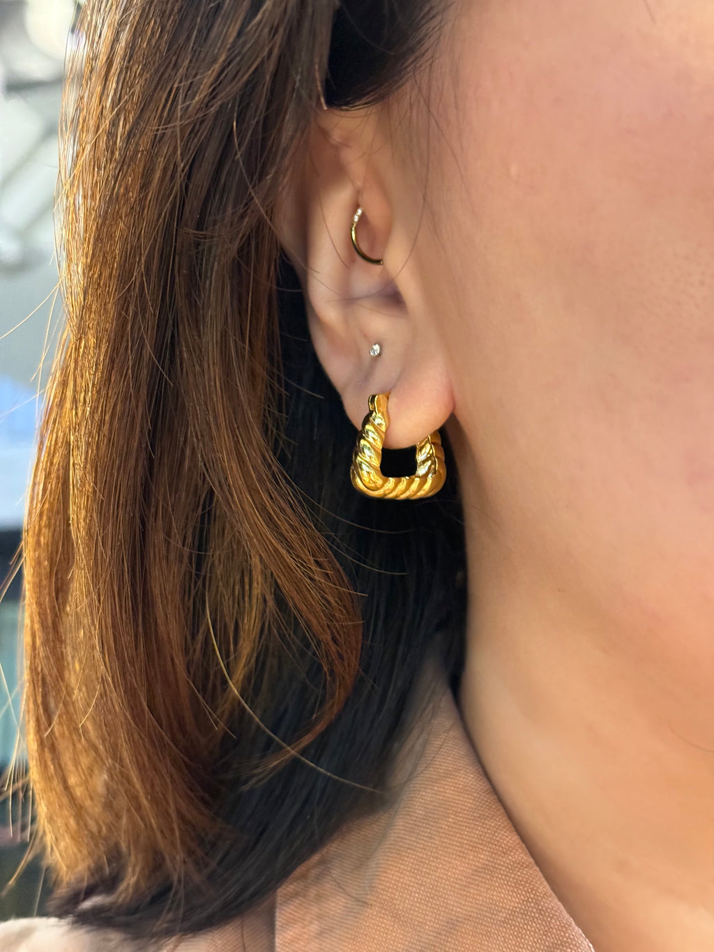 Golden twisted hoop earrings
