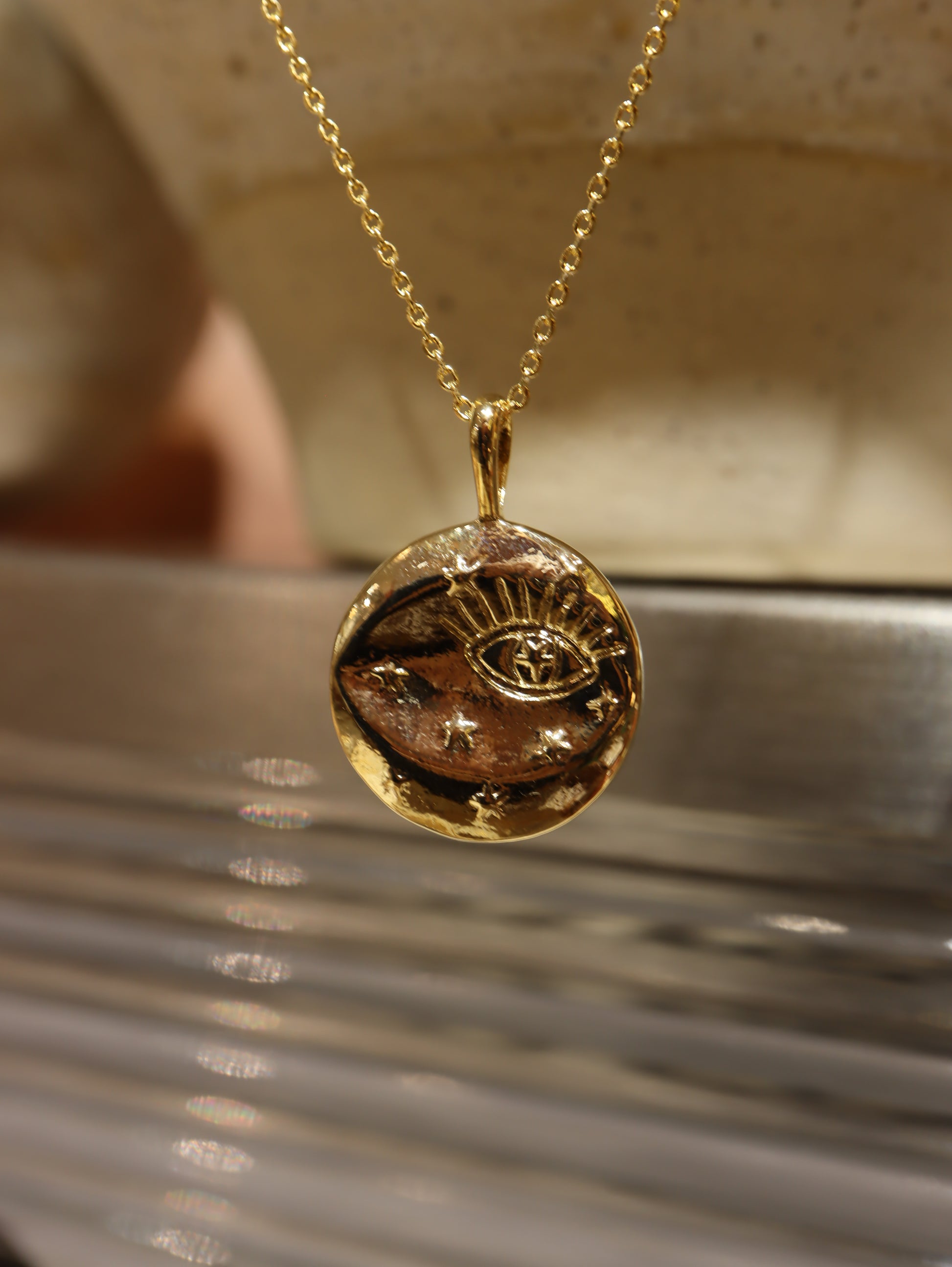 Eye coin brass necklace