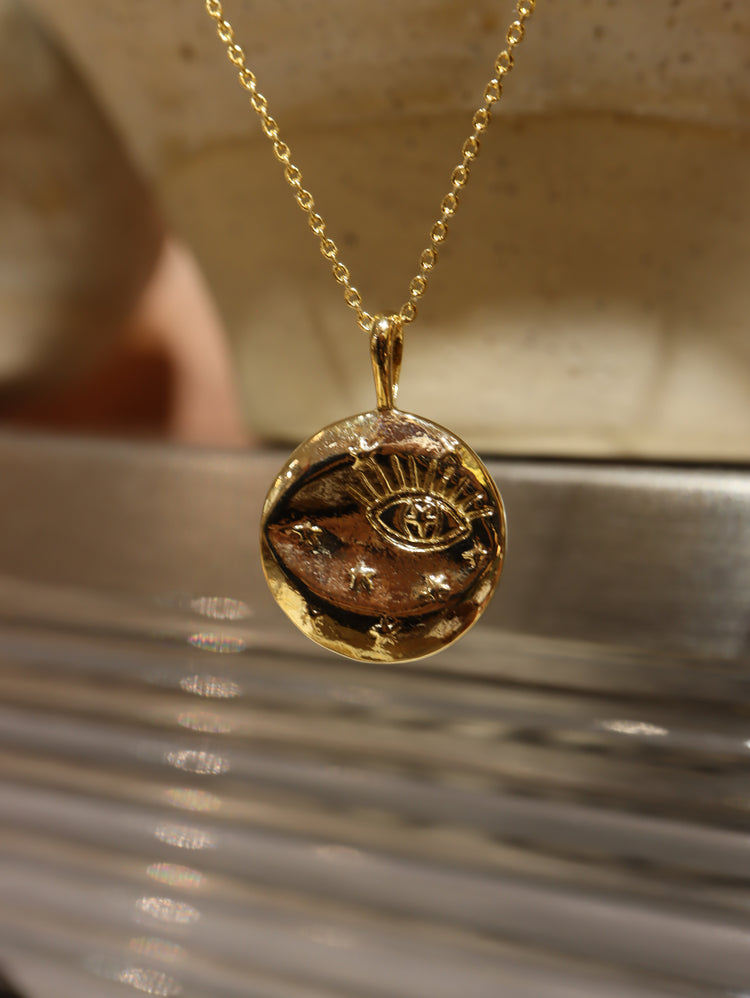 Eye coin brass necklace
