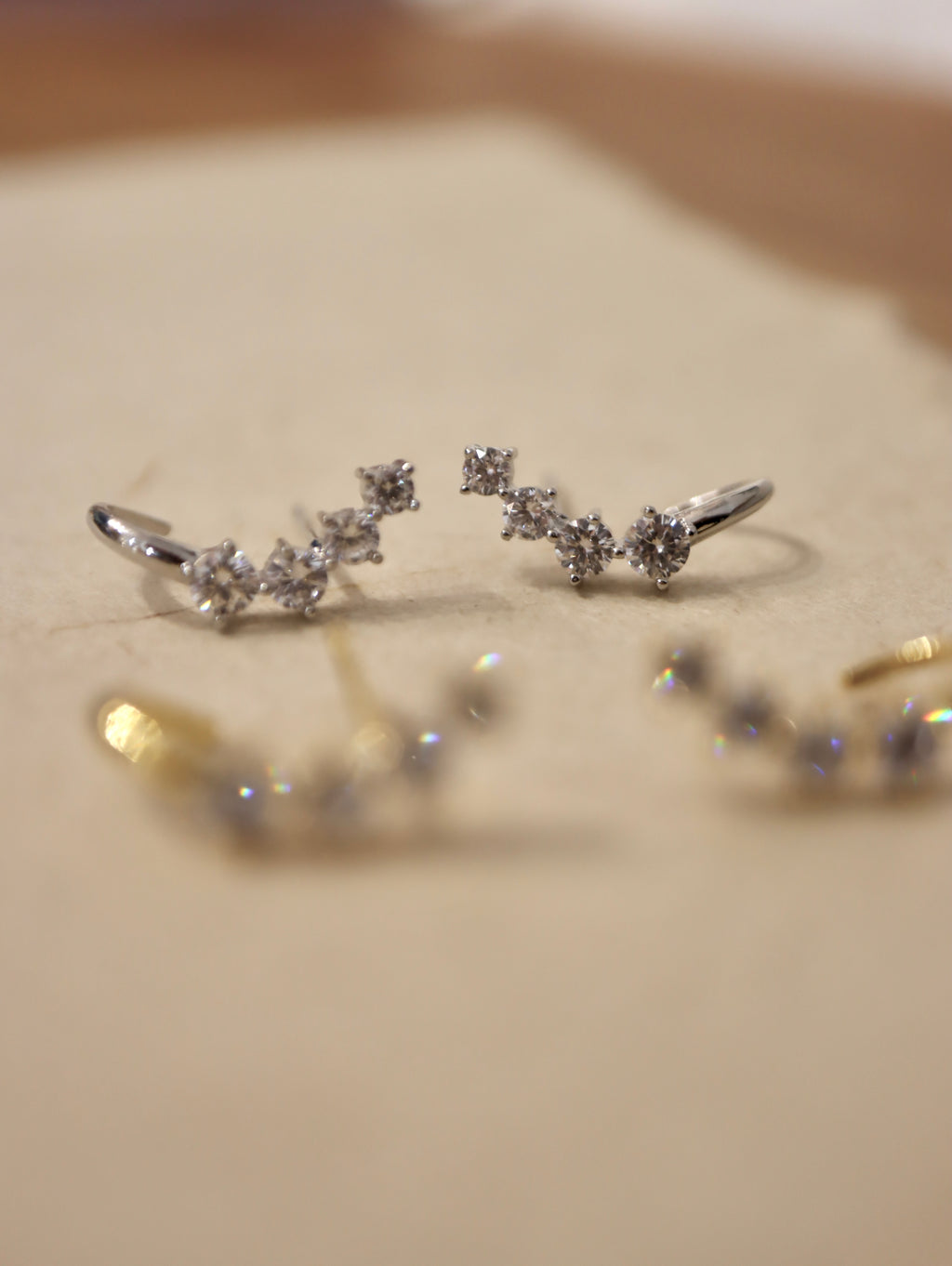 Curved cz brass earrings