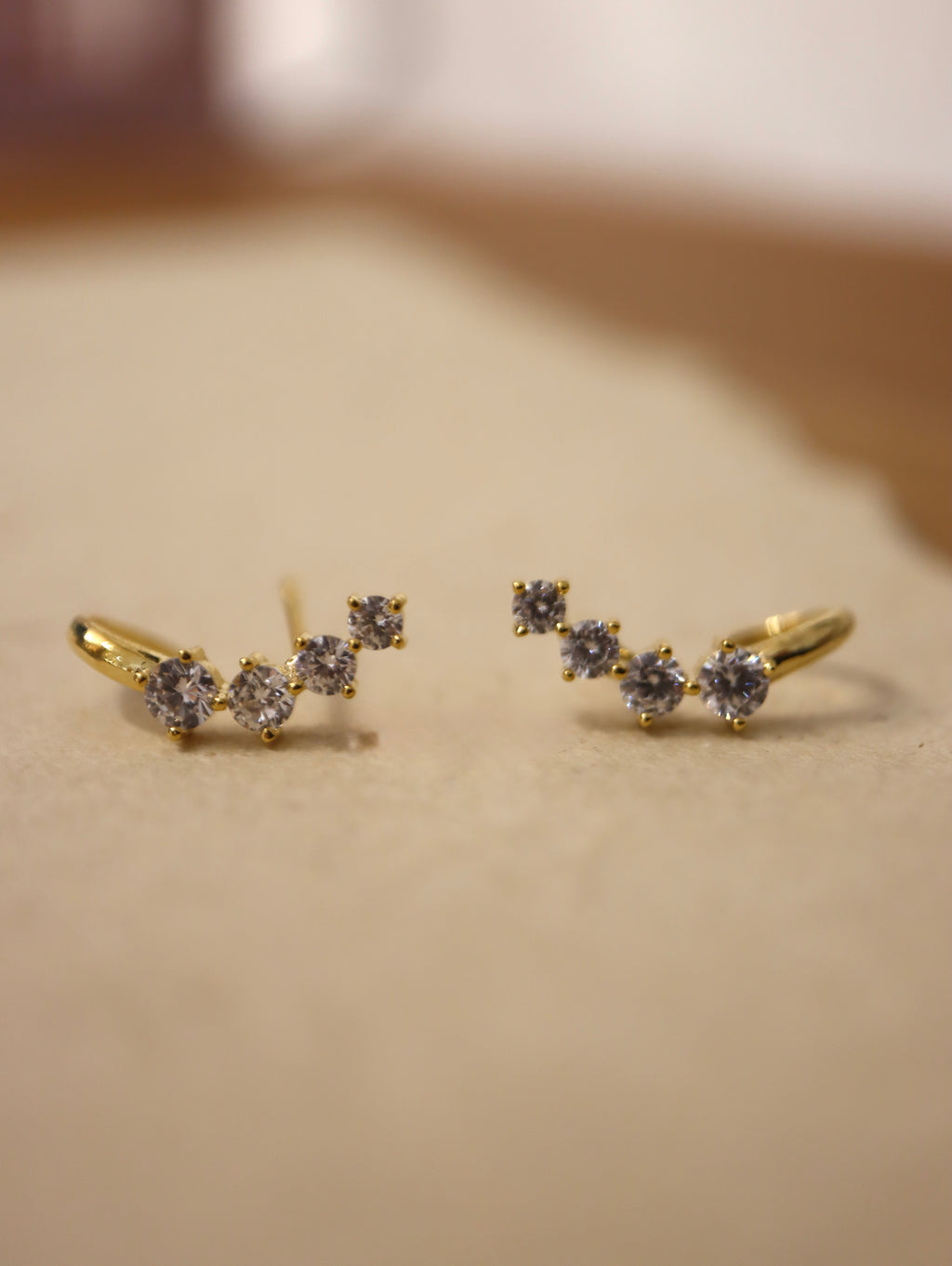 Curved cz brass earrings