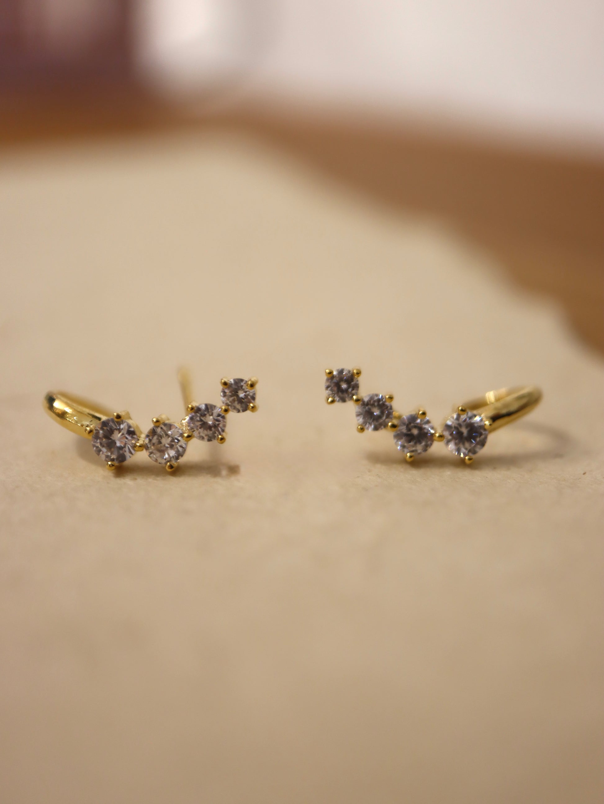 Curved cz brass earrings
