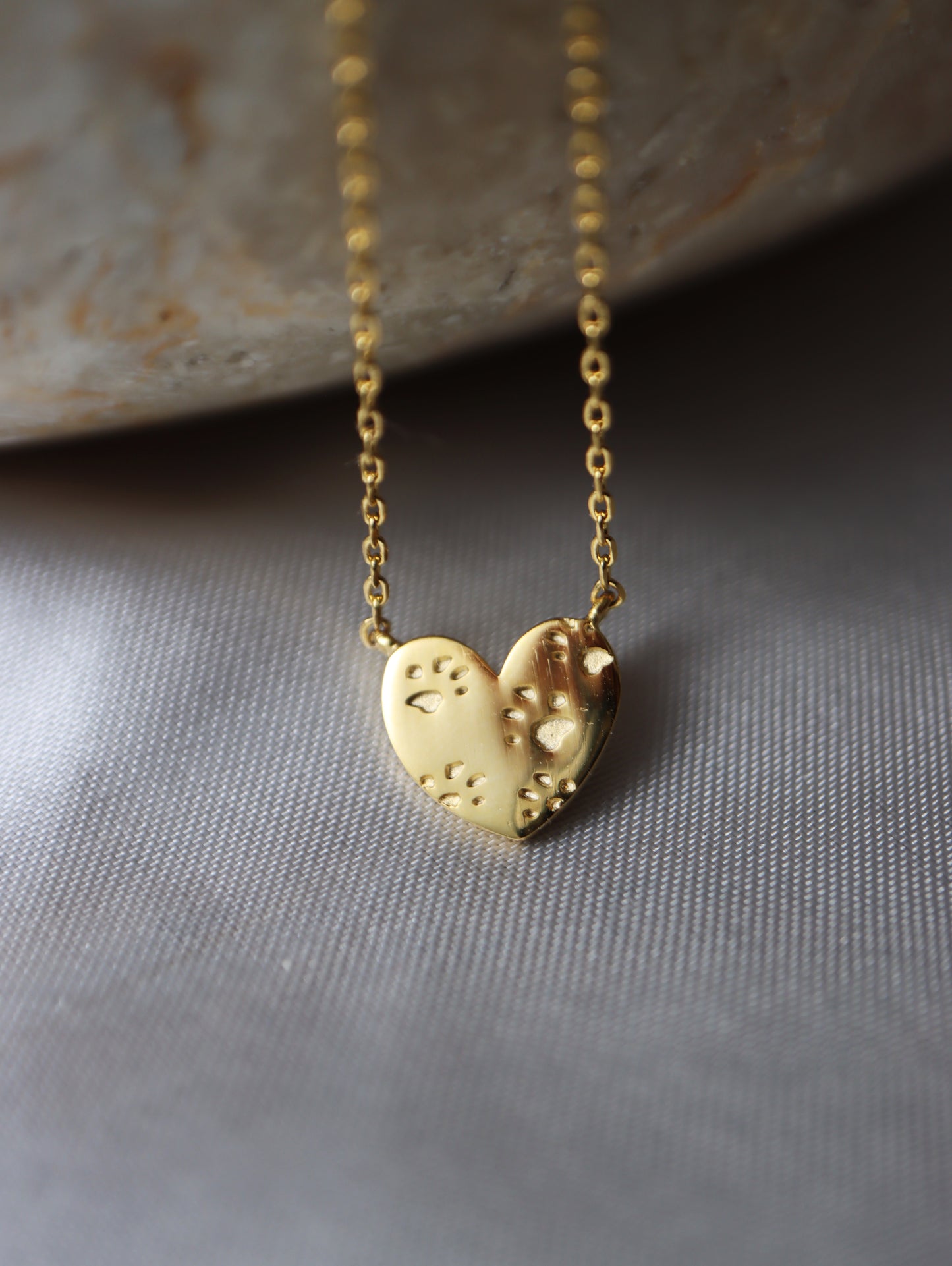 Paws on heart brass necklace