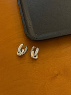 Interlock brass earrings
