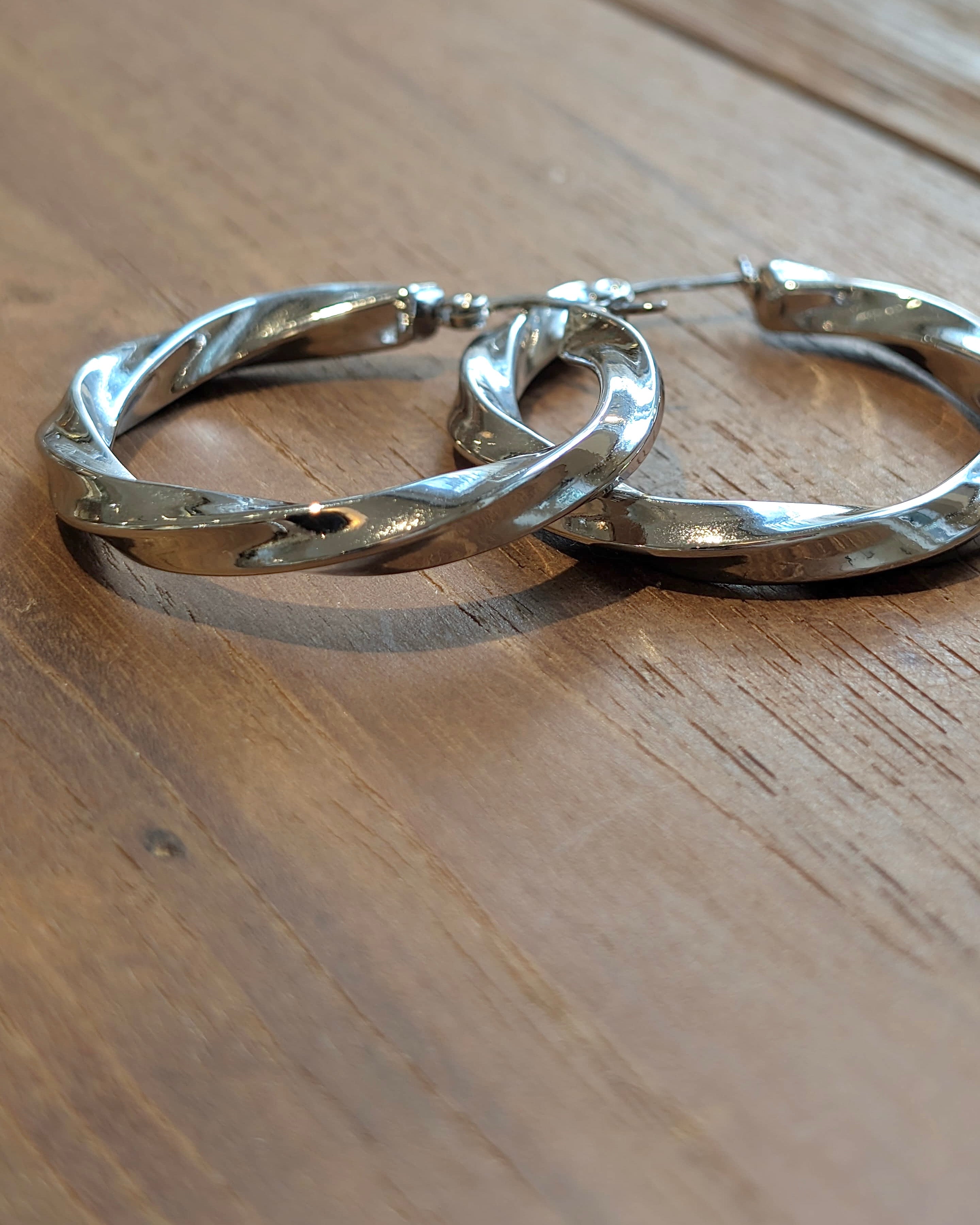Twisted statement hoop earrings