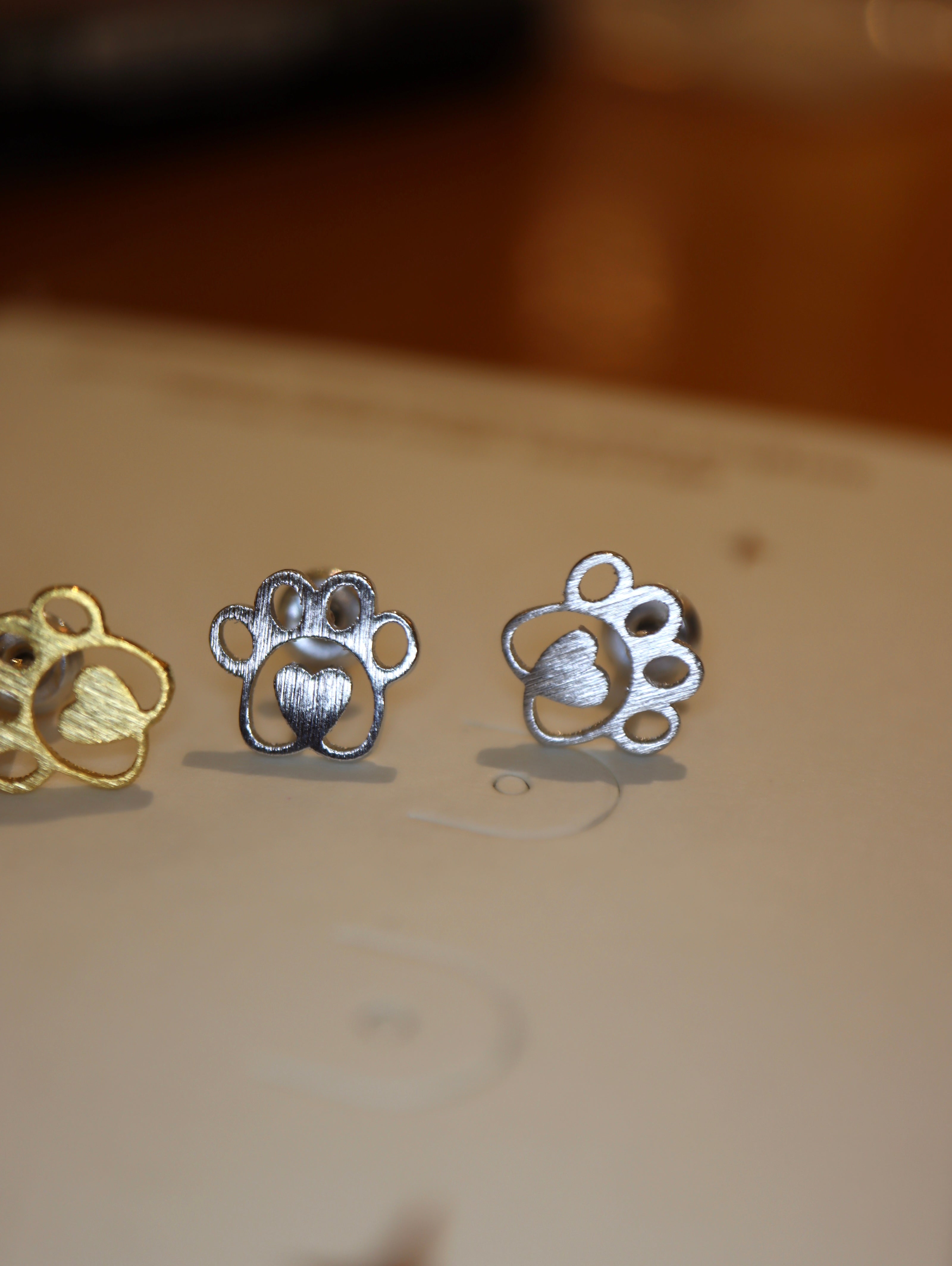 Heart center paws earrings