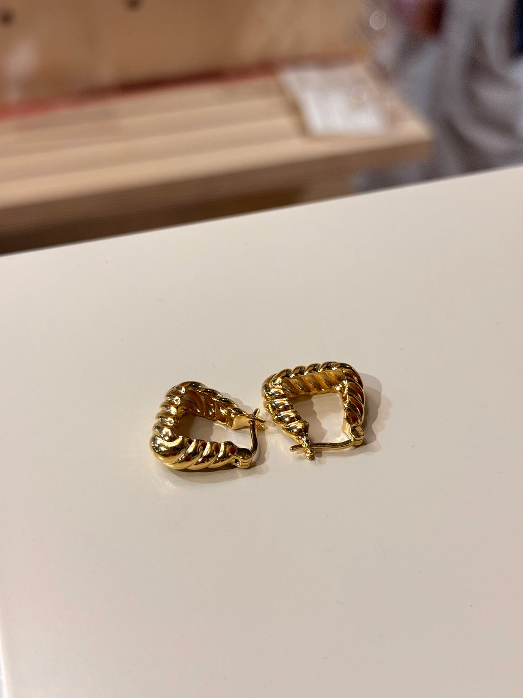 Golden twisted hoop earrings