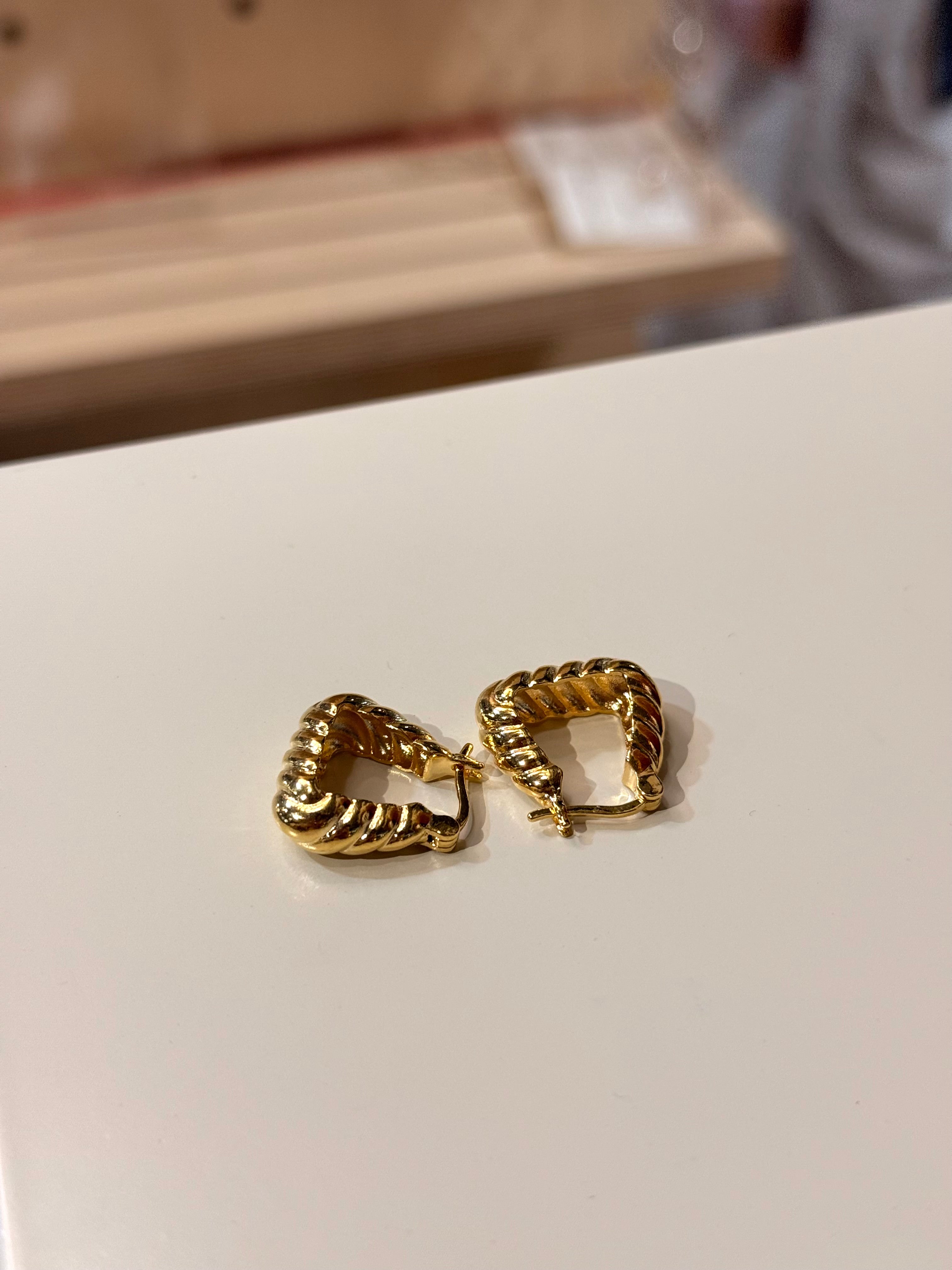 Golden twisted hoop earrings