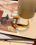 Bold wavy stainless steel bangle cuff