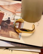 Bold wavy stainless steel bangle