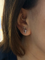 Stud cross barbell piercing