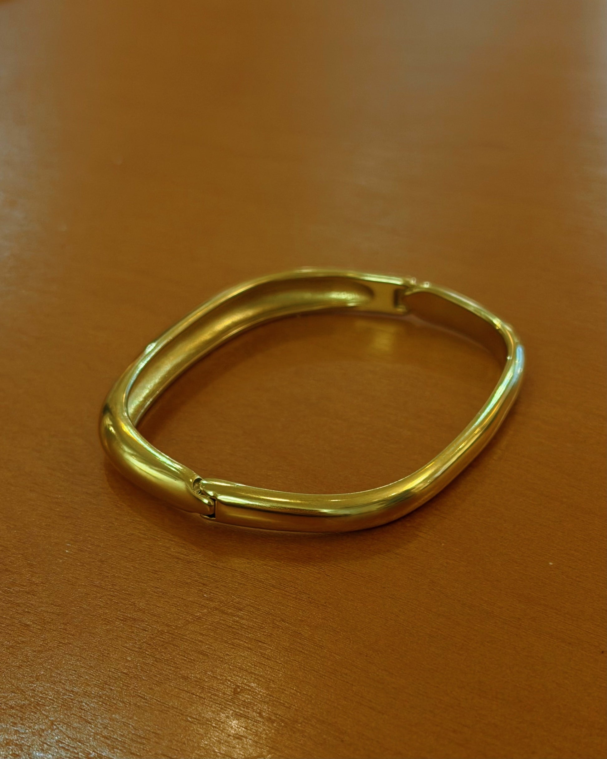 Stainless steel water resistant  lock bangle in gold