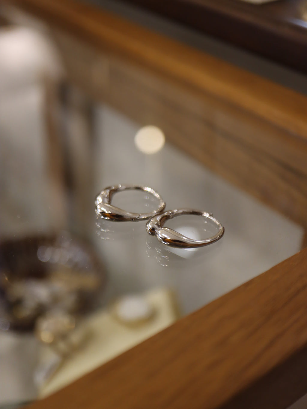 Hinged hoop base metal earrings