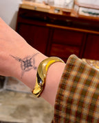 Bold wavy stainless steel bangle