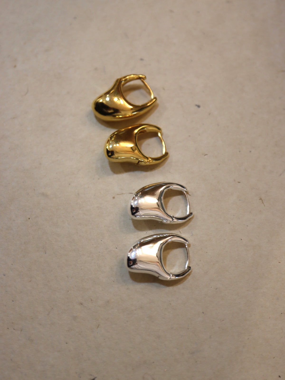 Irregular hoop brass earrings