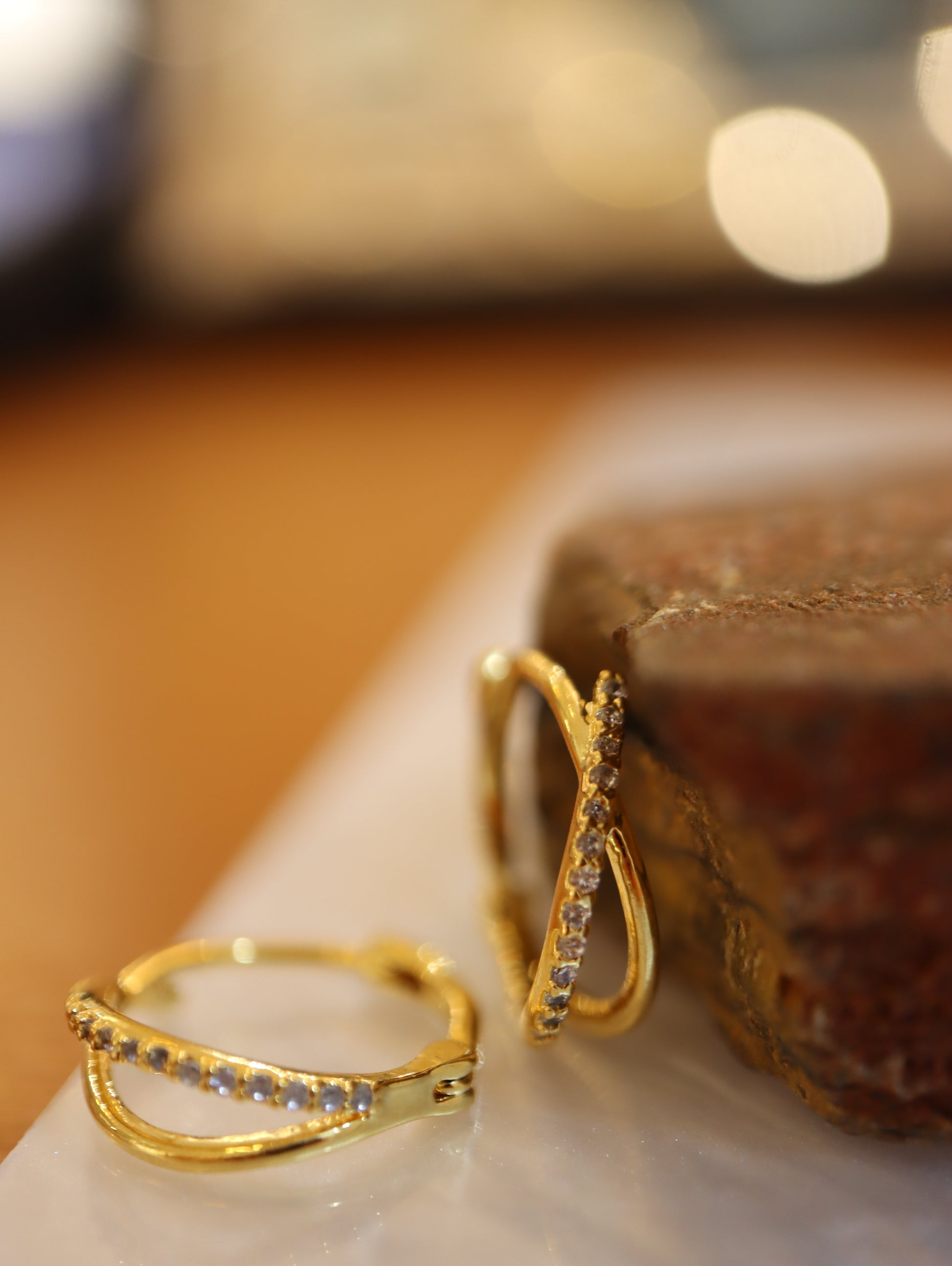 Double cross hinged hoop earrings