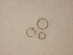 Surgical steel captive bead clicker