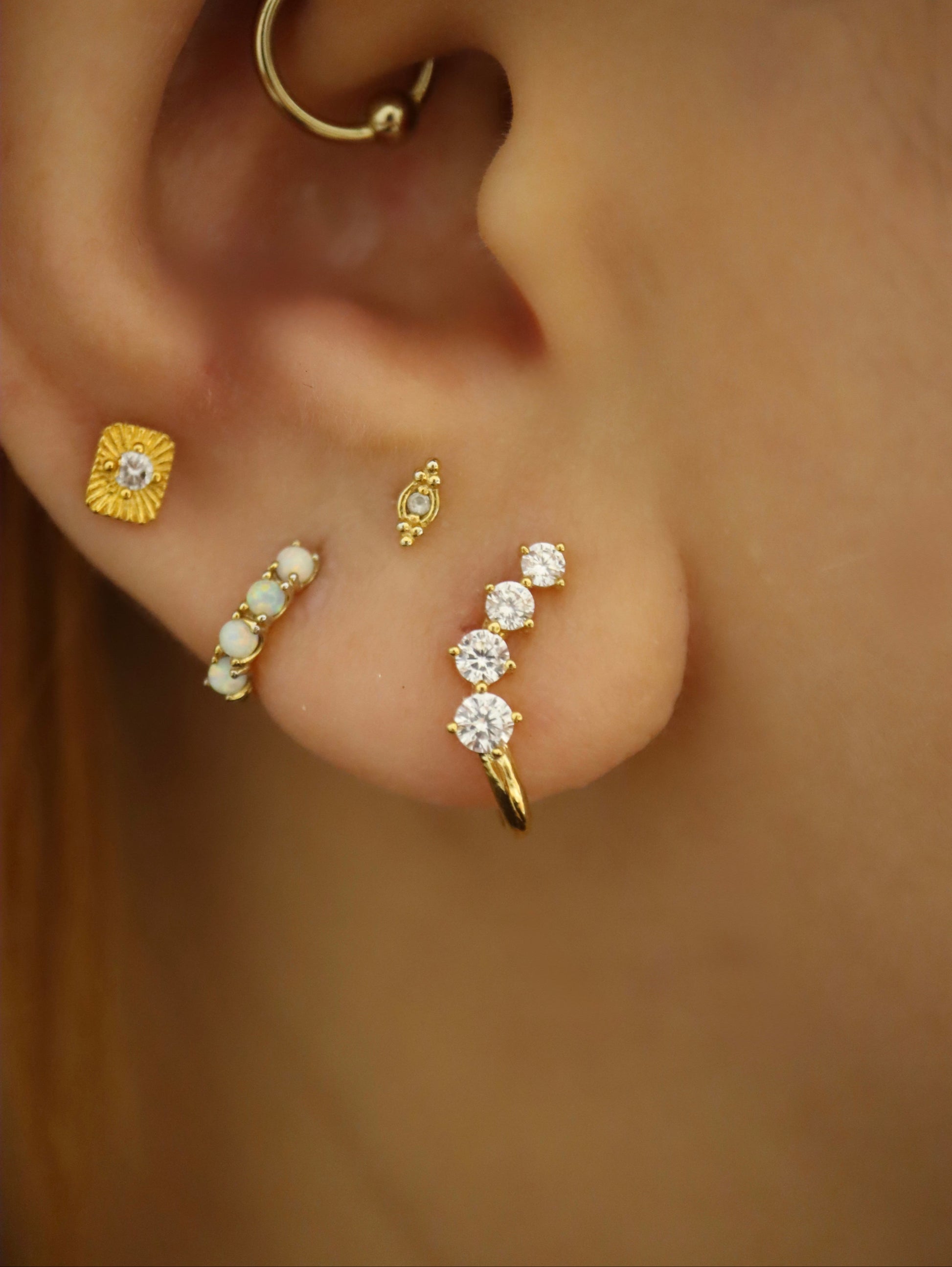 Curved cz brass earrings