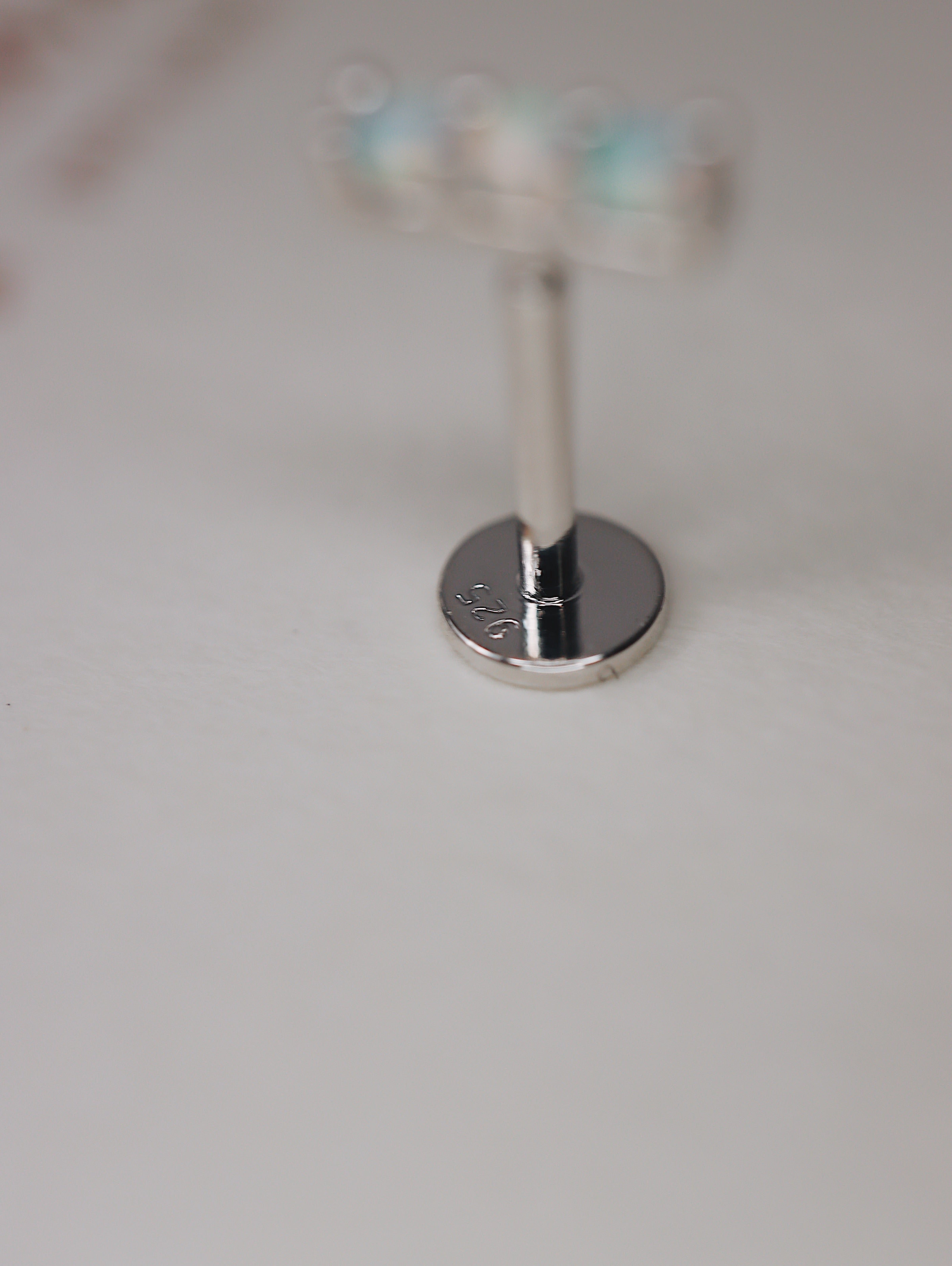Triple opal flat back piercing