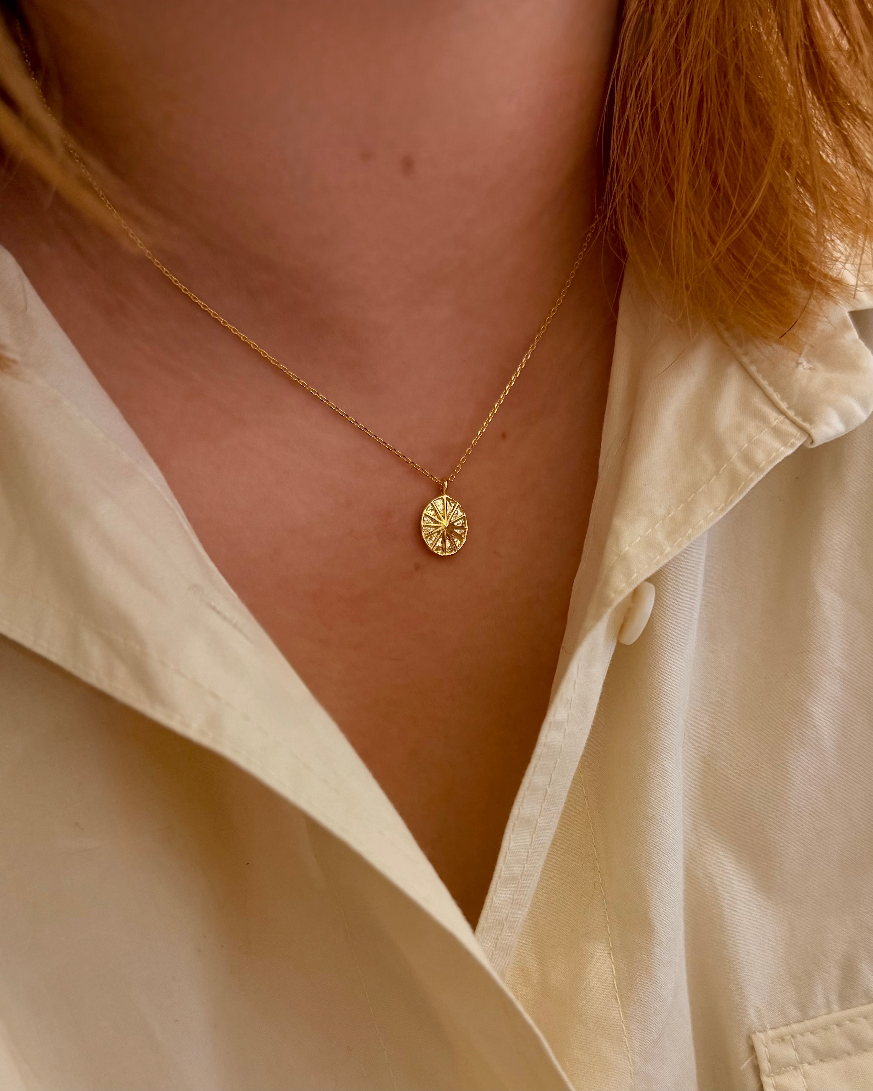 Oval sun ray brass necklace