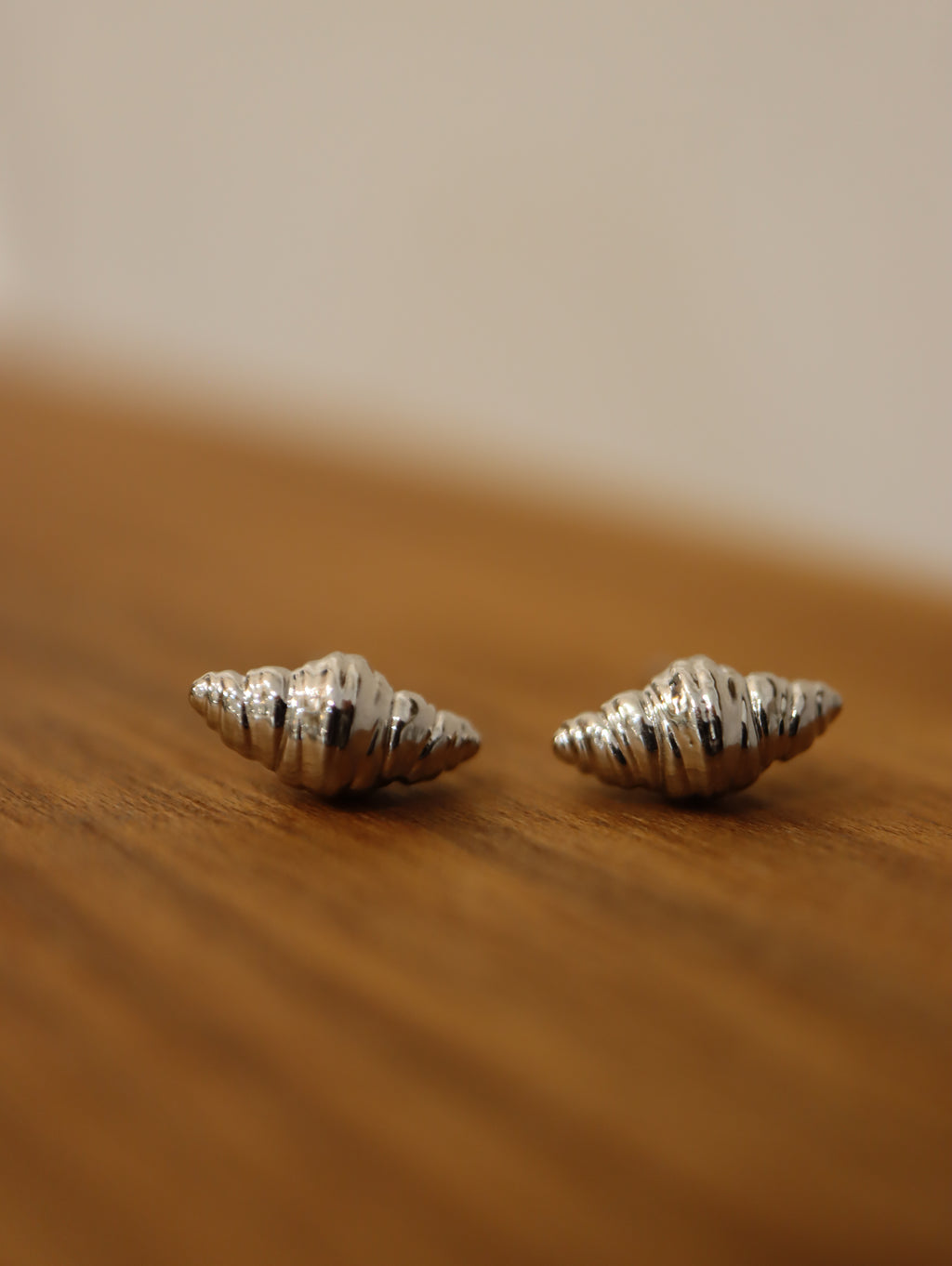 Mini croissant brass earrings