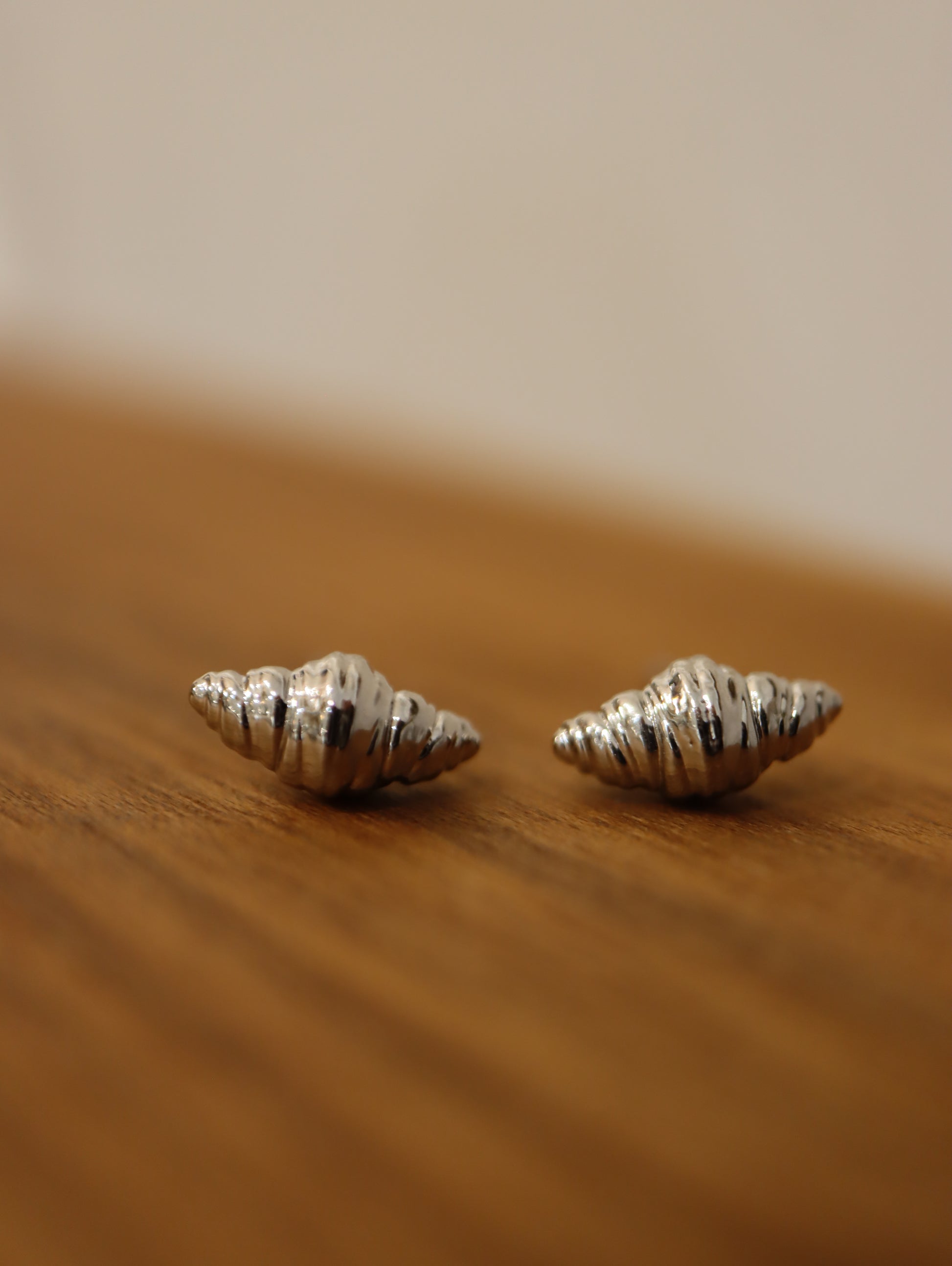 Mini croissant brass earrings