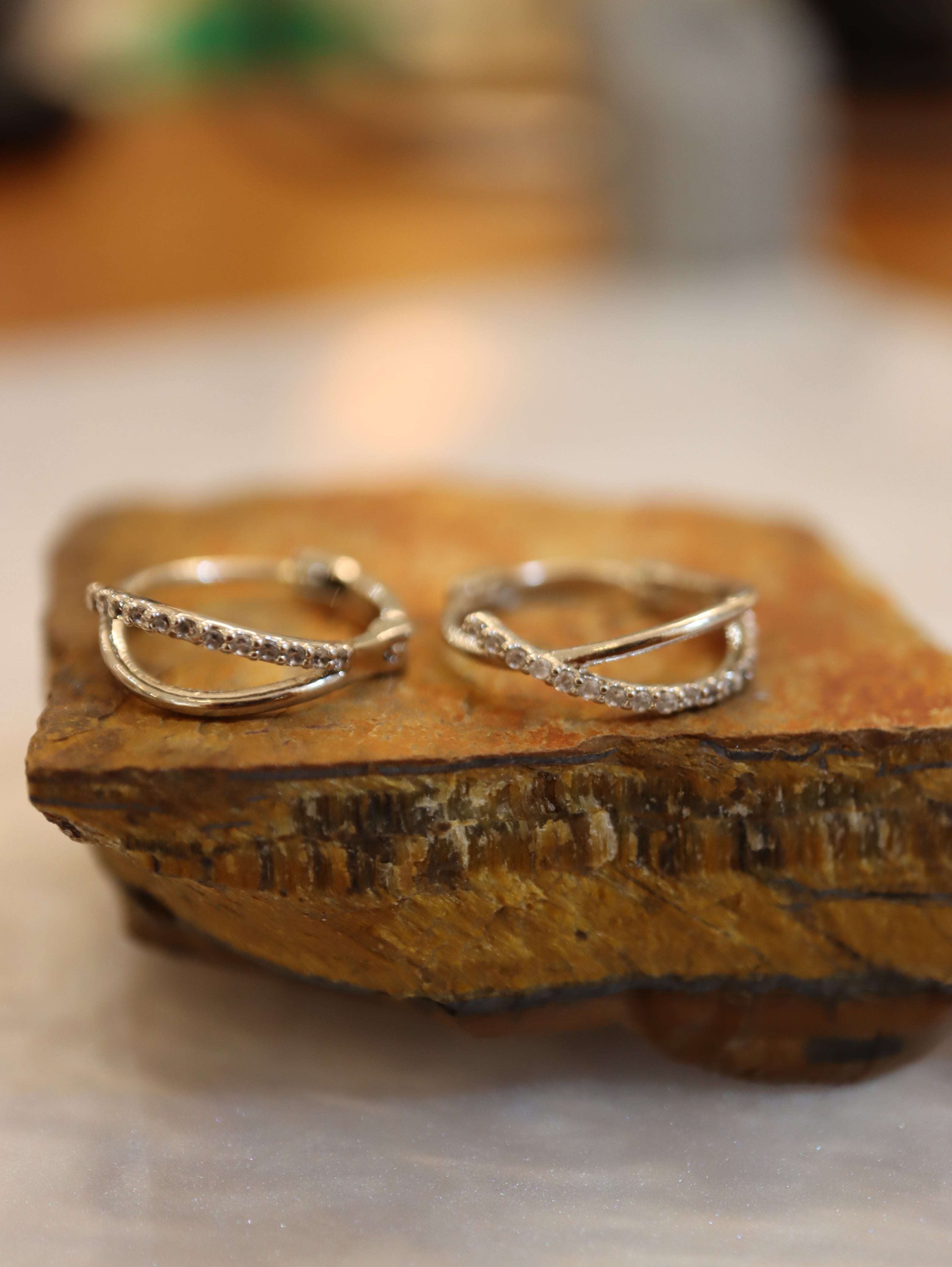 Double cross hinged hoop earrings