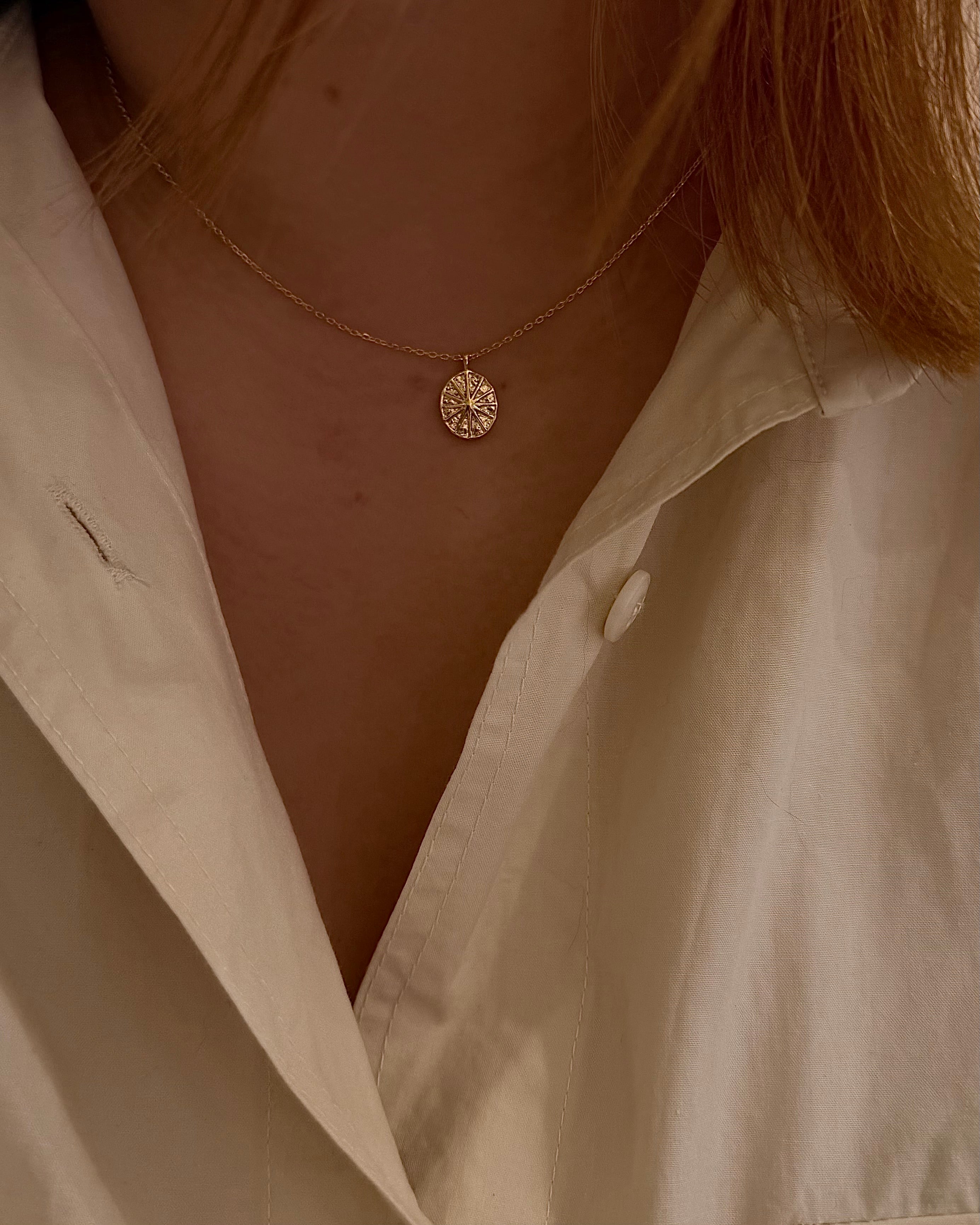 Oval sun ray brass necklace