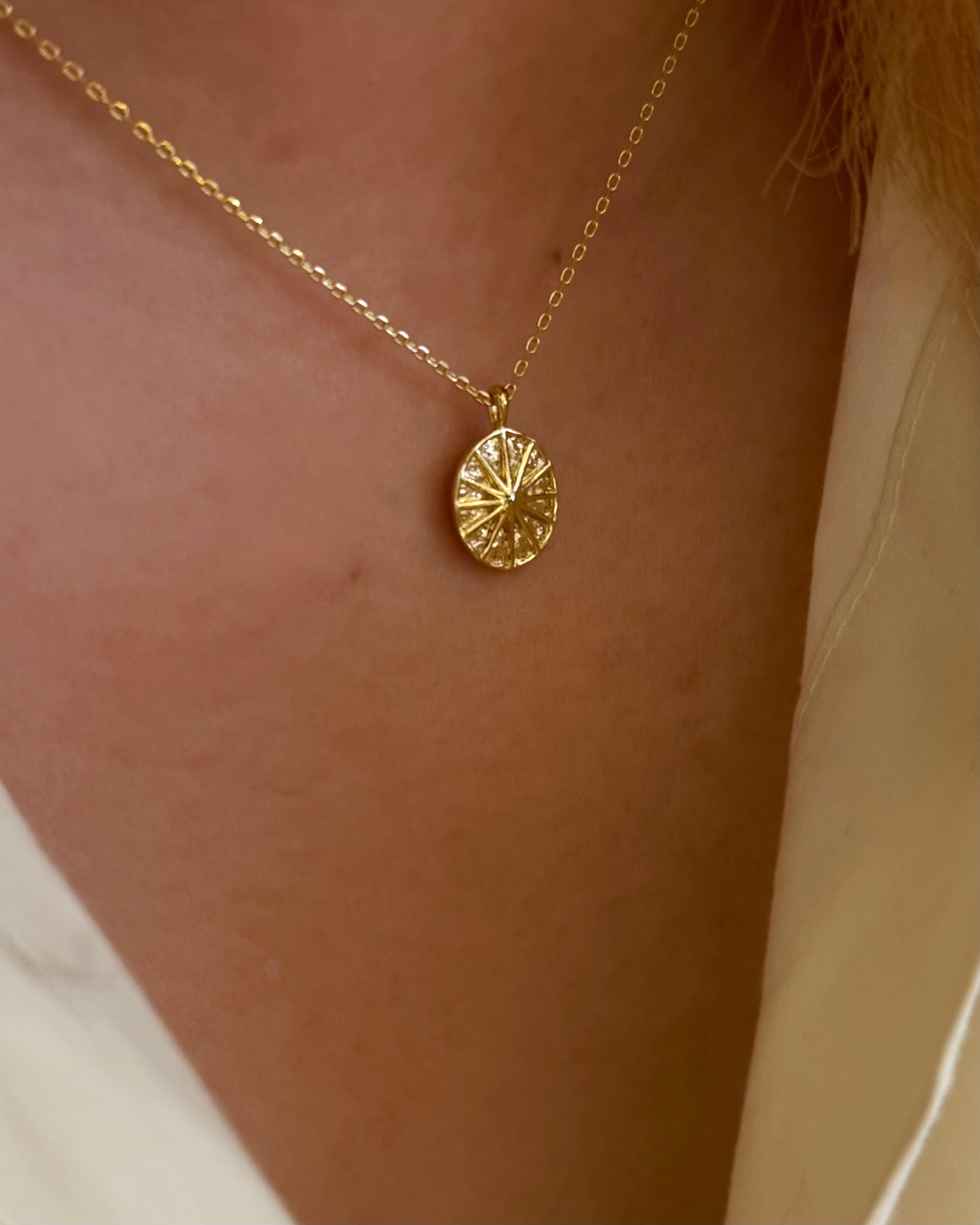 Oval sun ray brass necklace