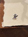 Stud cross barbell piercing