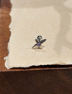 Stud cross barbell piercing
