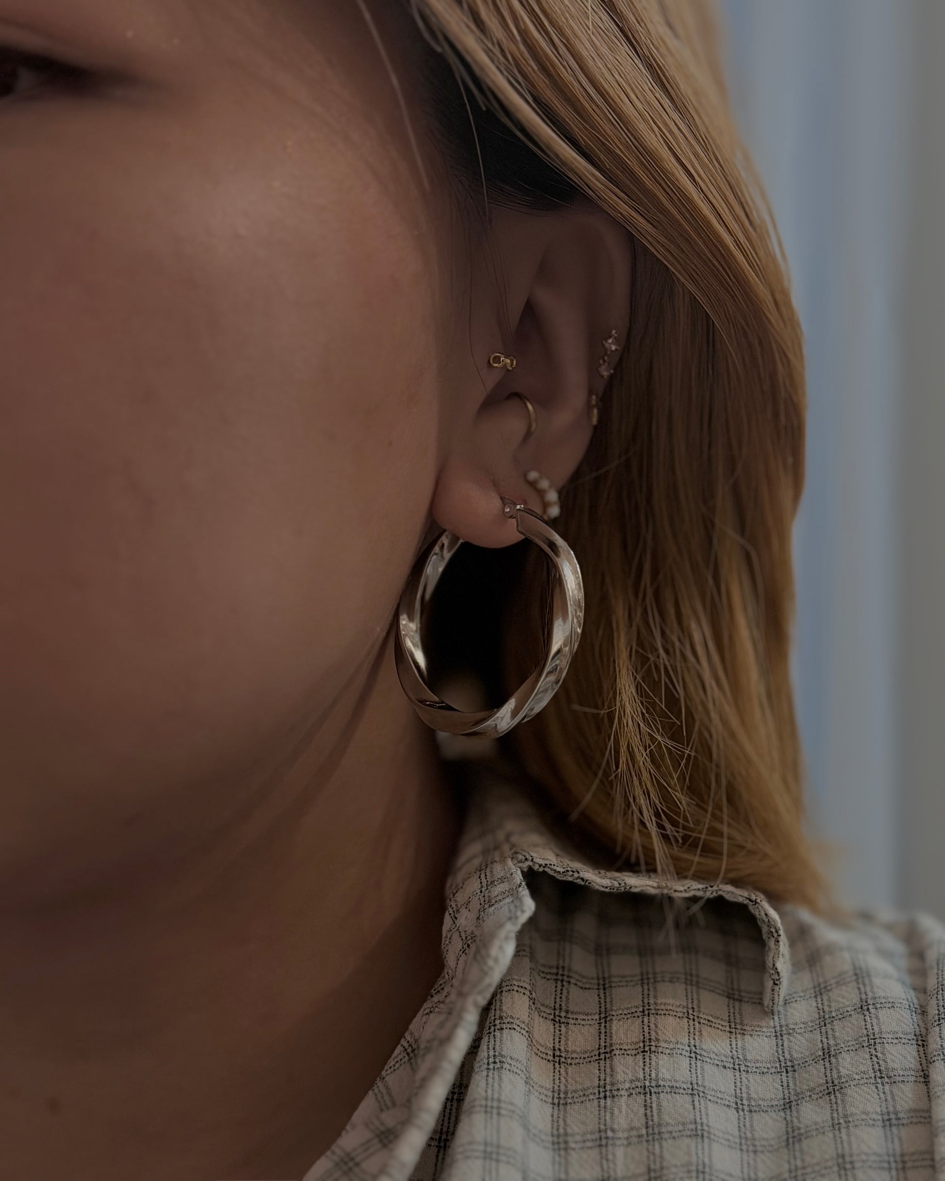 Twisted statement hoop earrings
