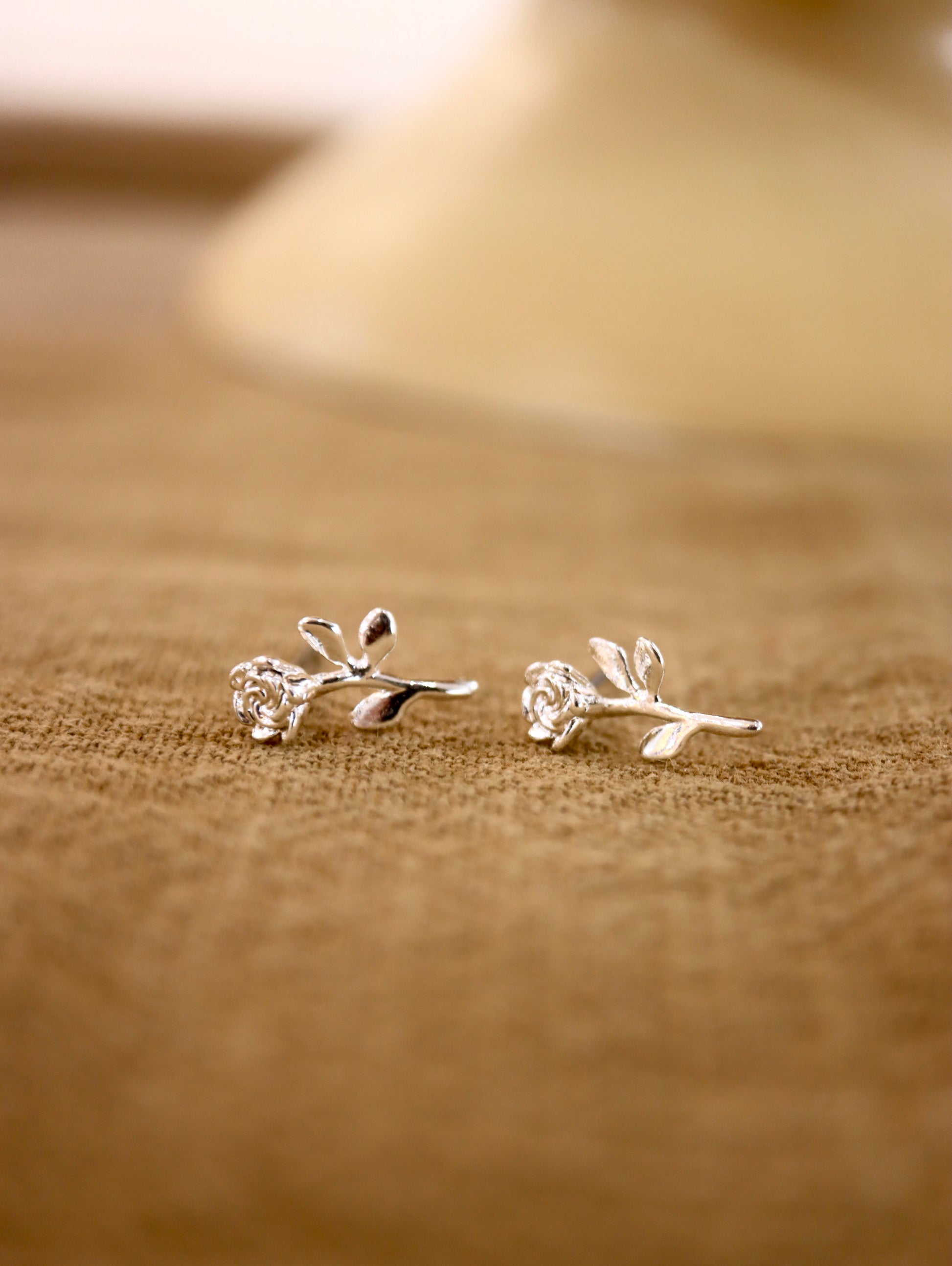 Rose silver tone earrings