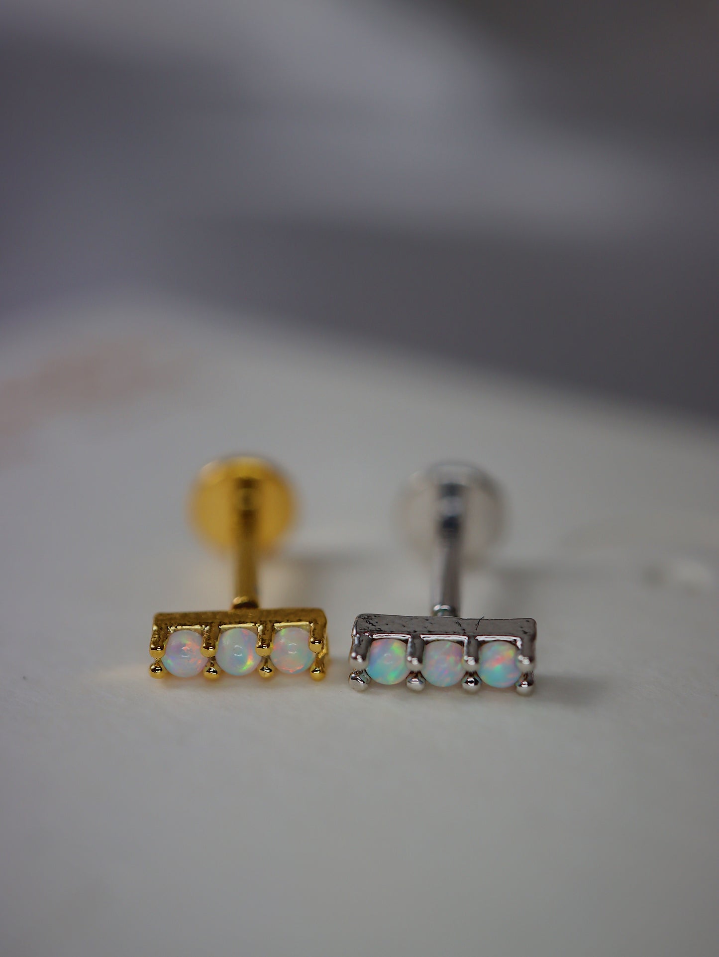 Triple opal flat back piercing