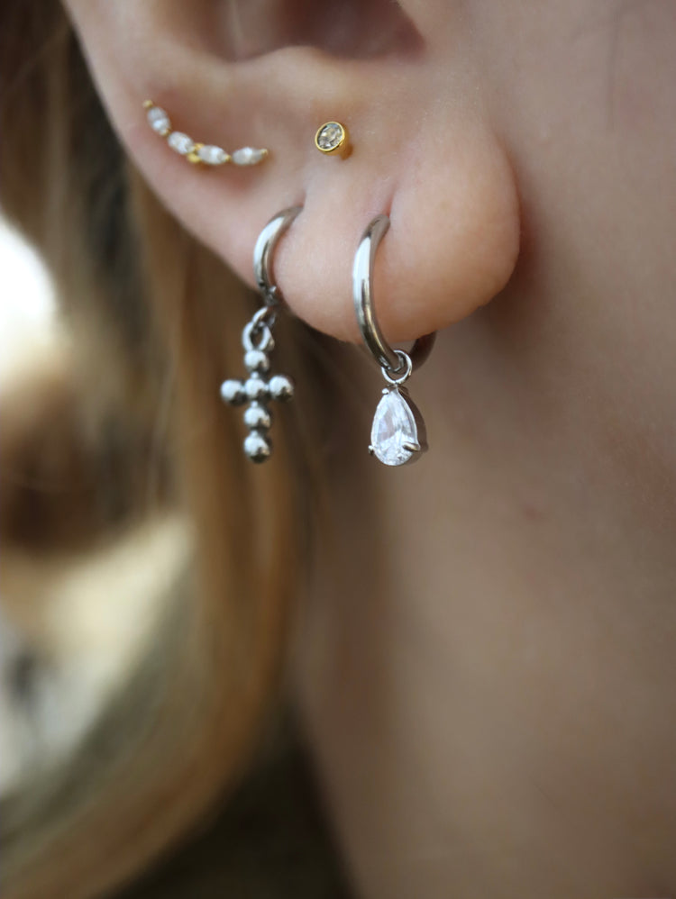 Hinged hoop drop cross earrings