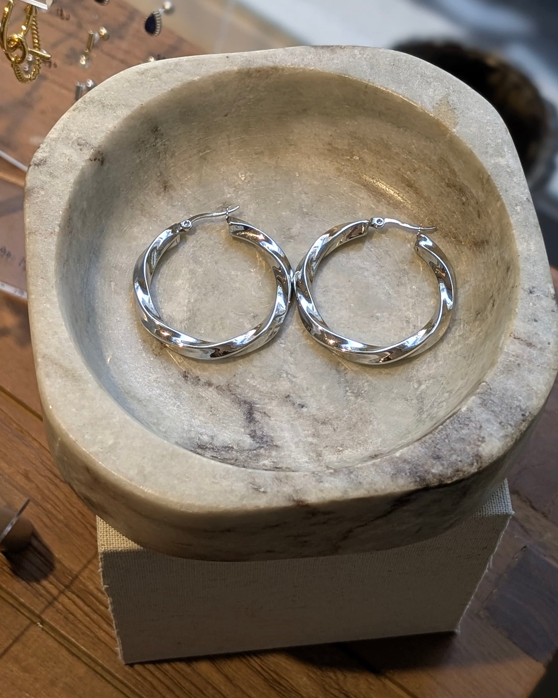 Twisted statement hoop earrings