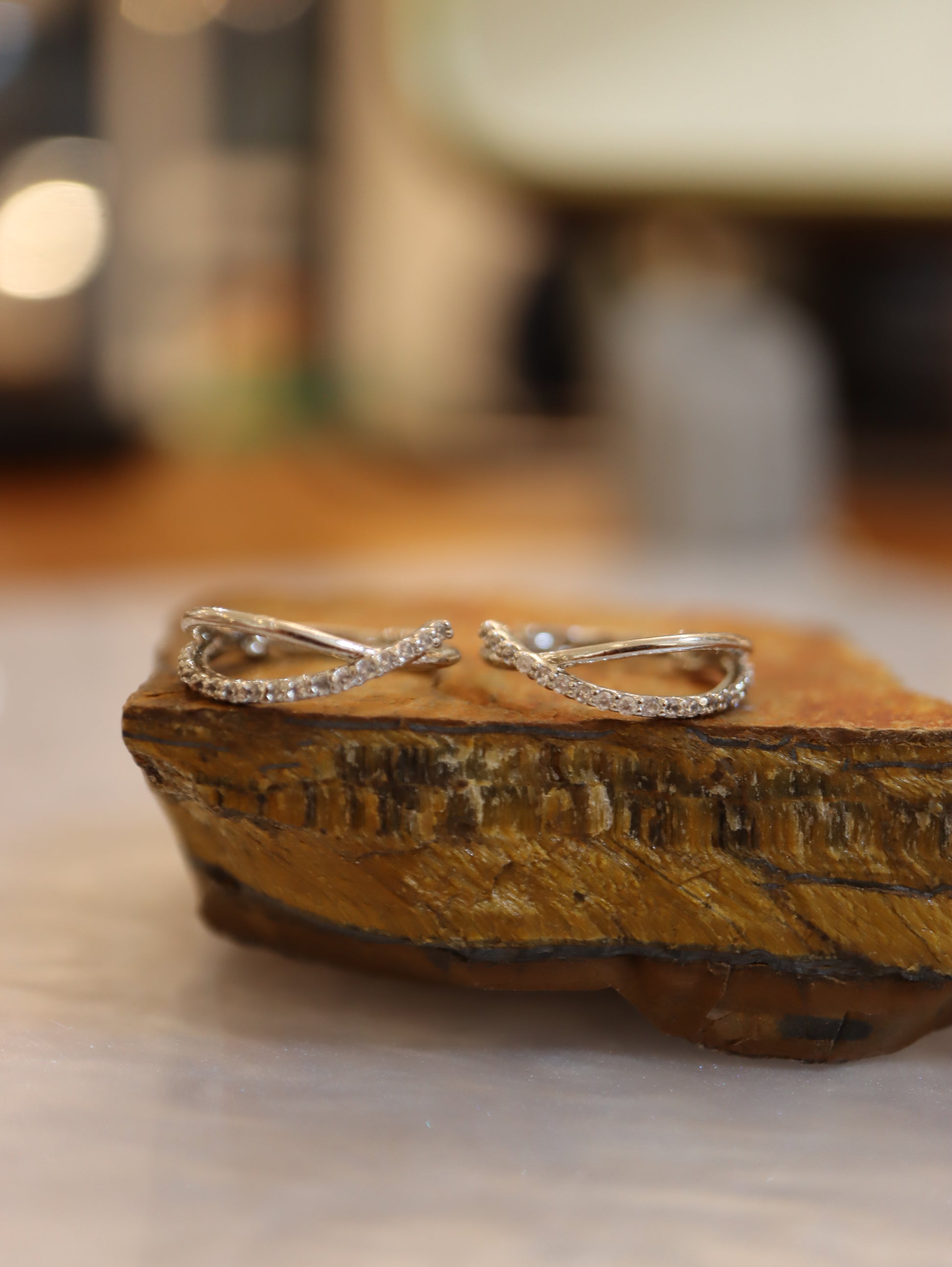 Double cross hinged hoop earrings