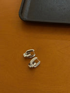 Interlock brass earrings