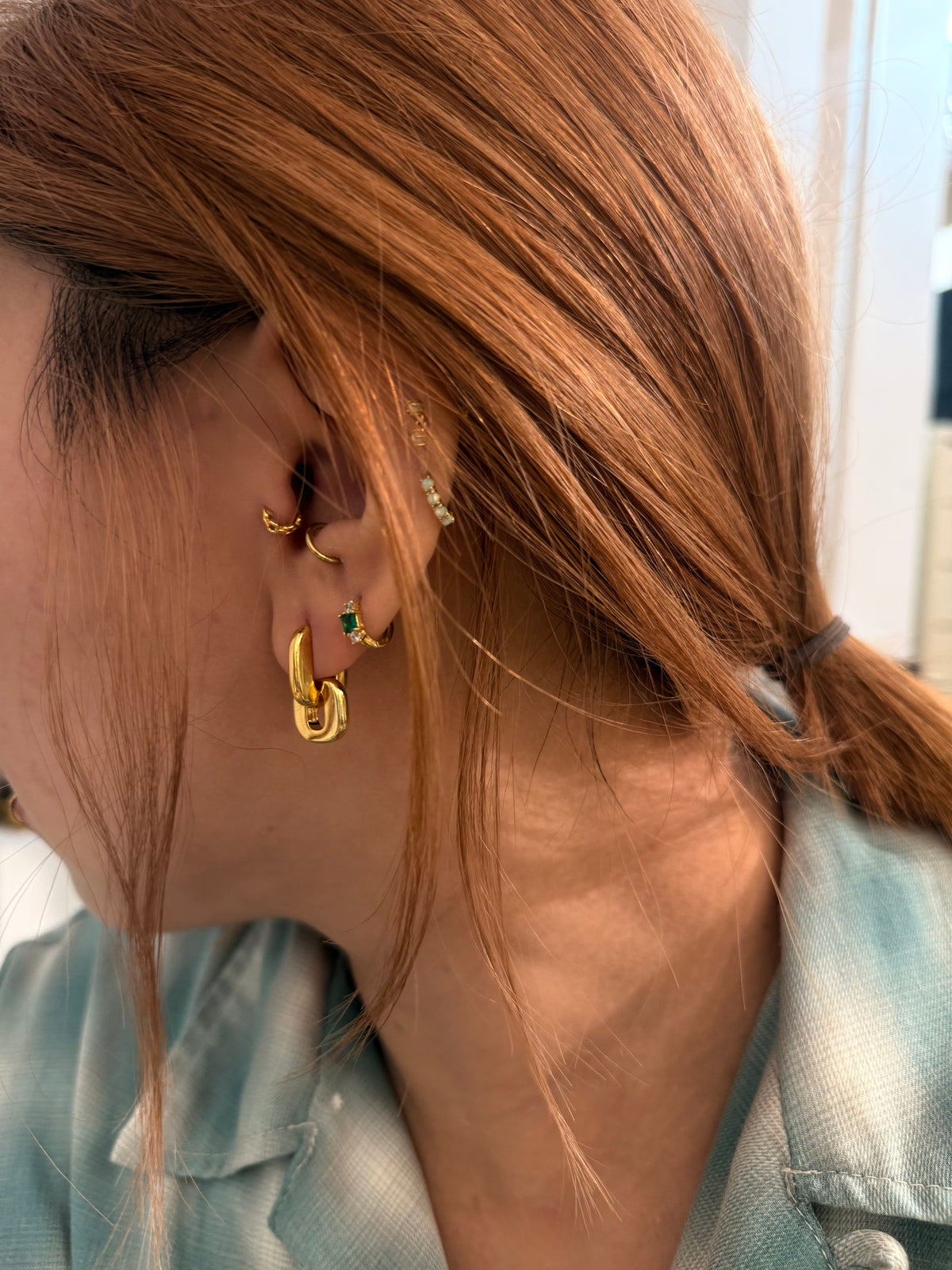 Interlock brass earrings