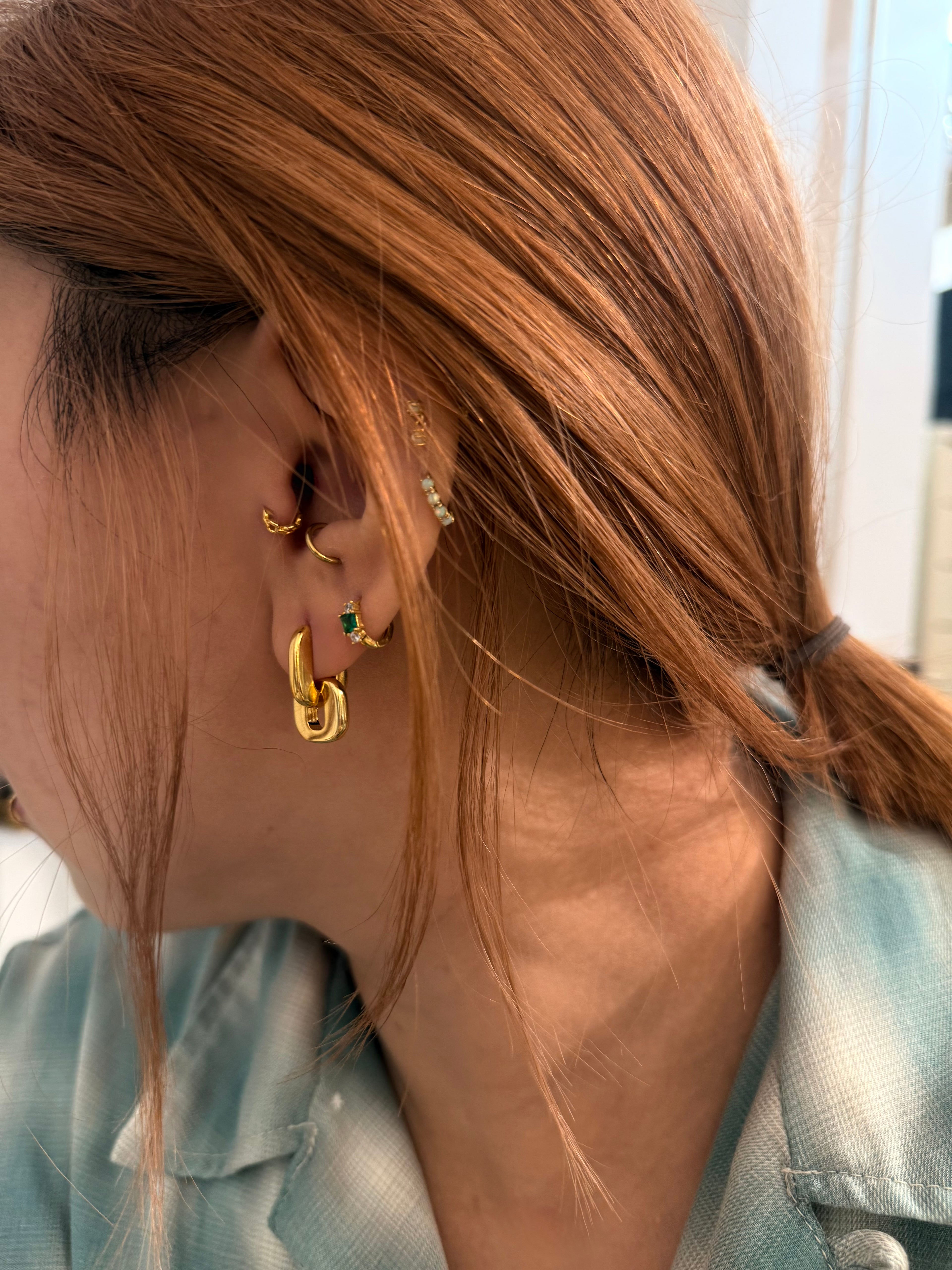 Interlock brass earrings