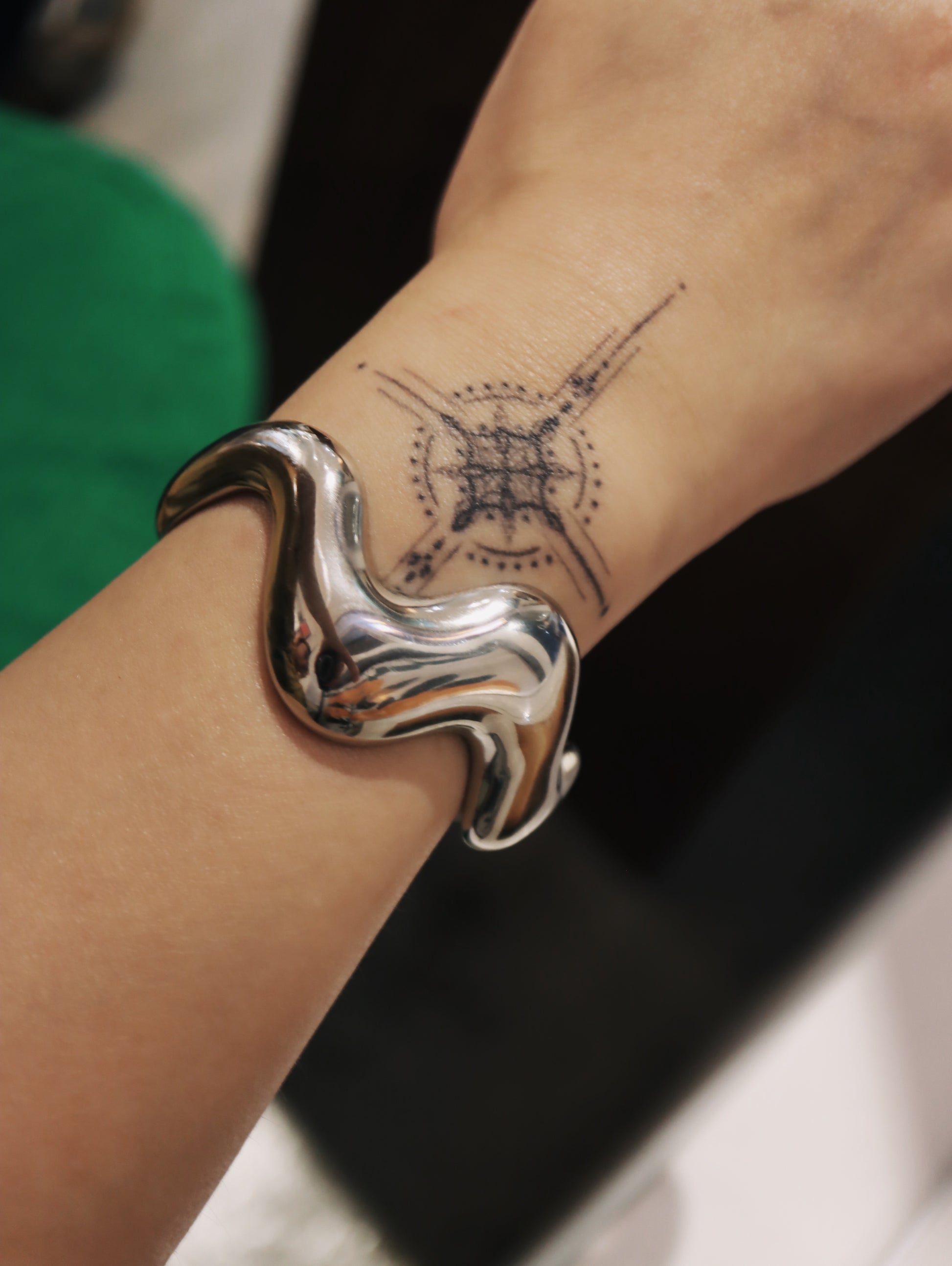 Wavy statement stainless steel bangle