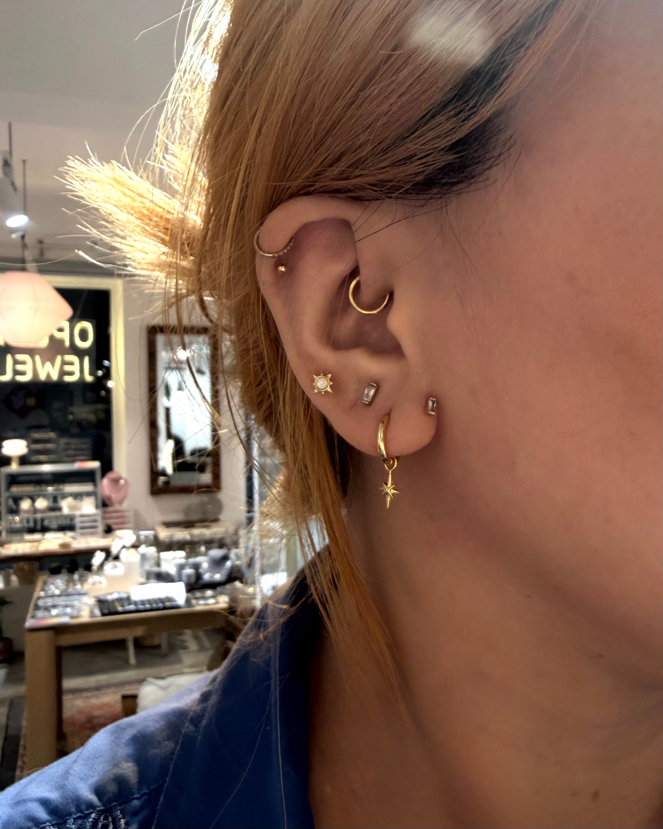 Hinged hoop drop starburst earrings