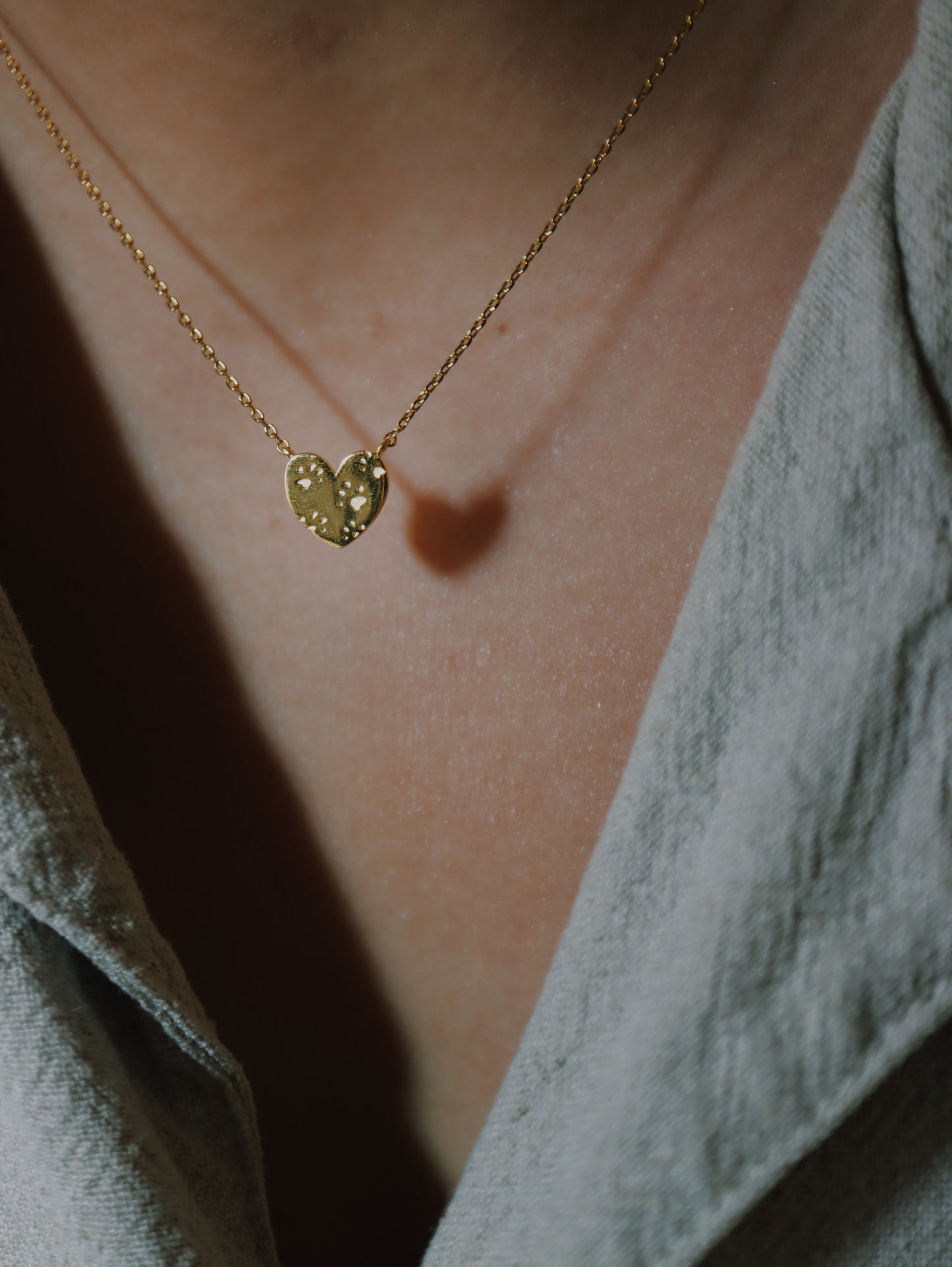 Paws on heart brass necklace