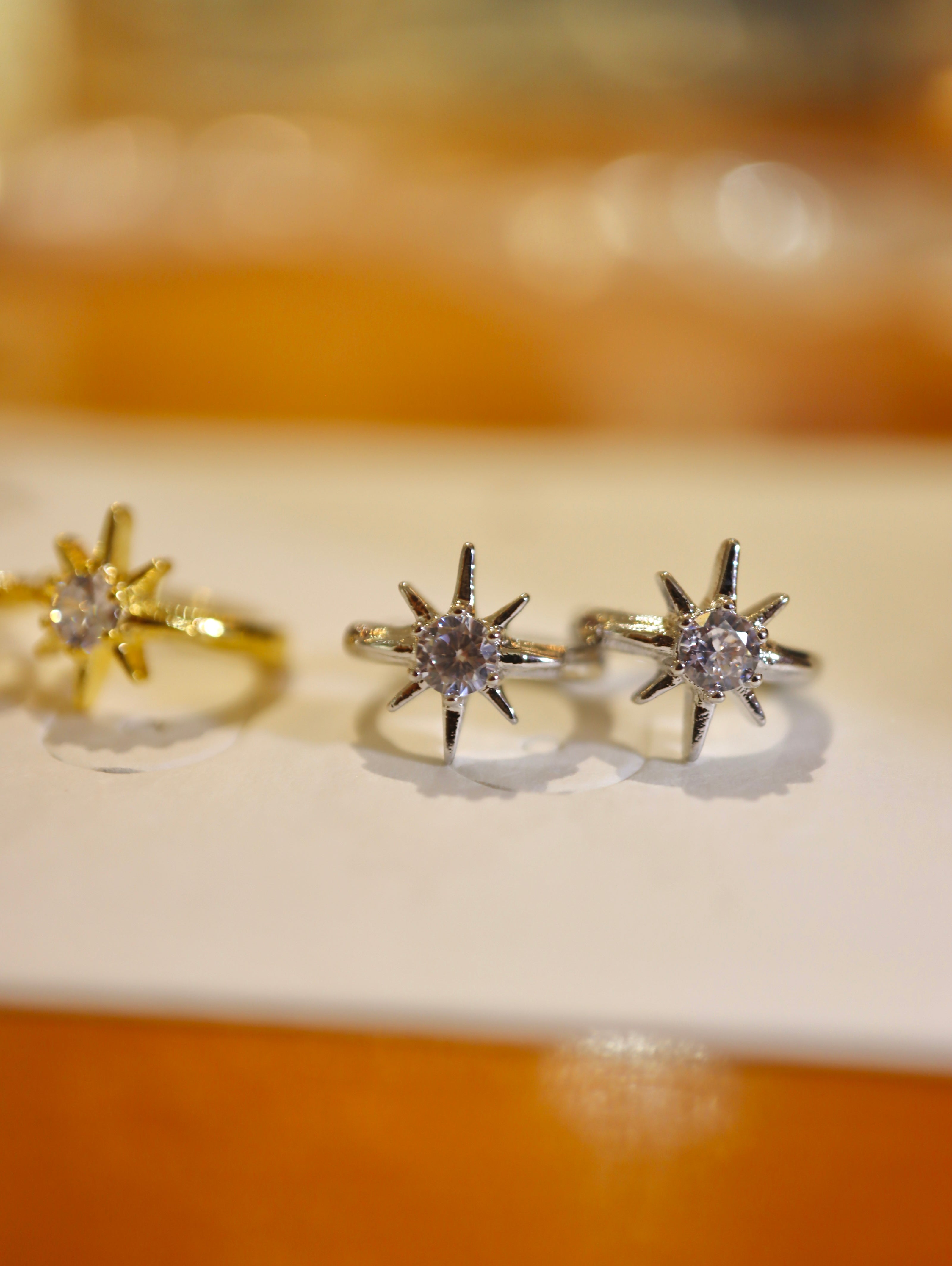 Solaris Star Hinged Hoop Earrings