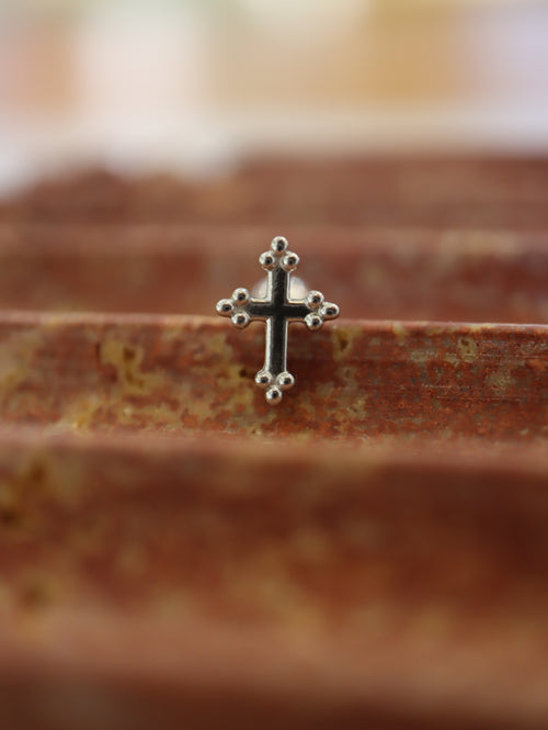 Cross surgical steel piering stud