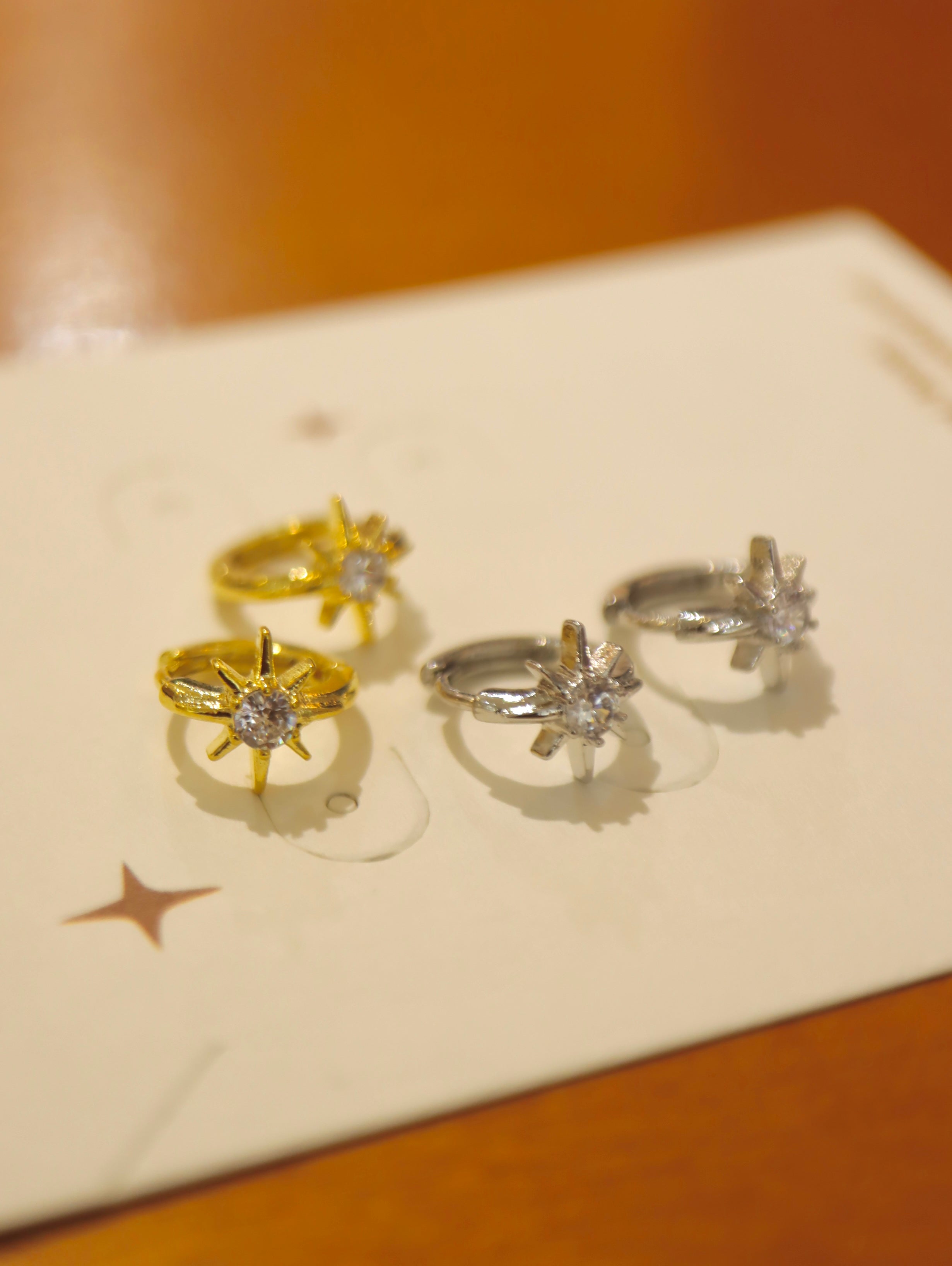 Solaris Star Hinged Hoop Earrings