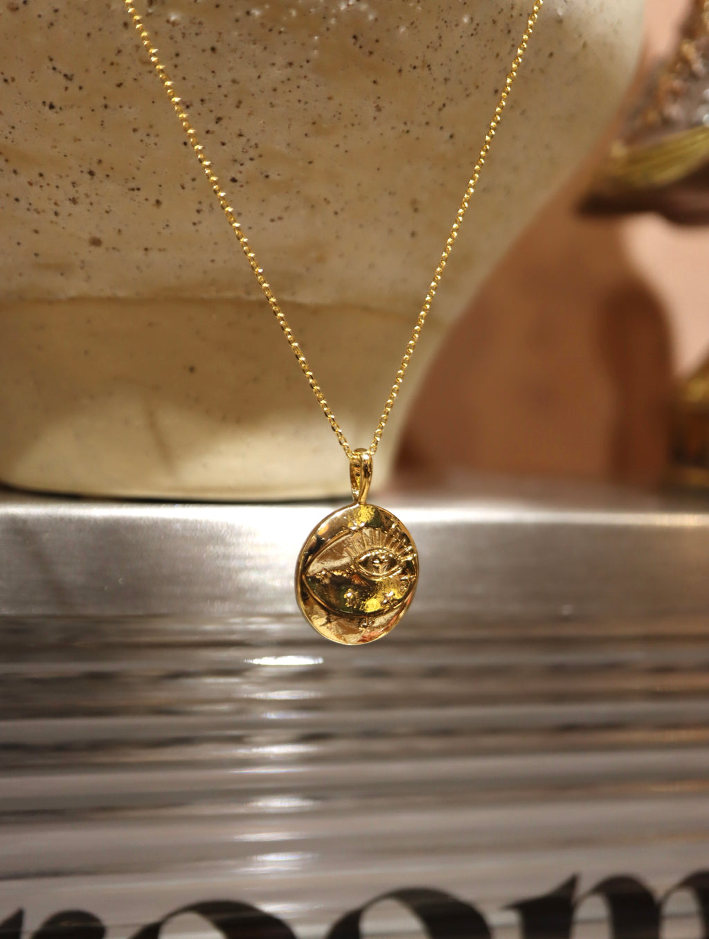Eye coin brass necklace